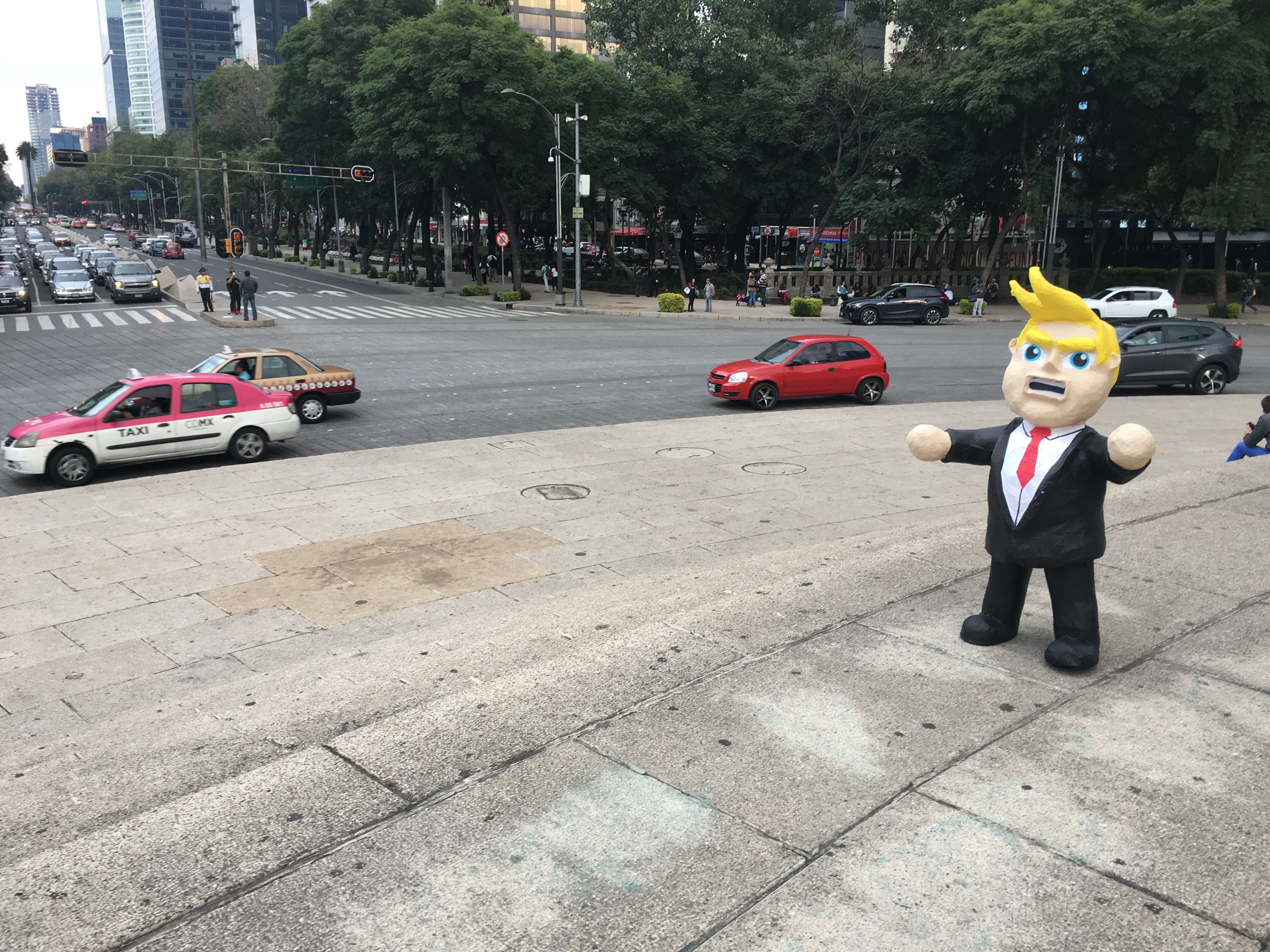 A Donald Trump piñata in the center of Mexico City. Many Mexicans are deeply fearful of Trump's enacting his campaign promises to cancel or alter NAFTA, restrict remittances sent to Mexico from the United States, deport millions of undocumented immigrants living in the U.S., and build a wall along the U.S.-Mexico border. Image by Nick Schifrin. Mexico, 2016.