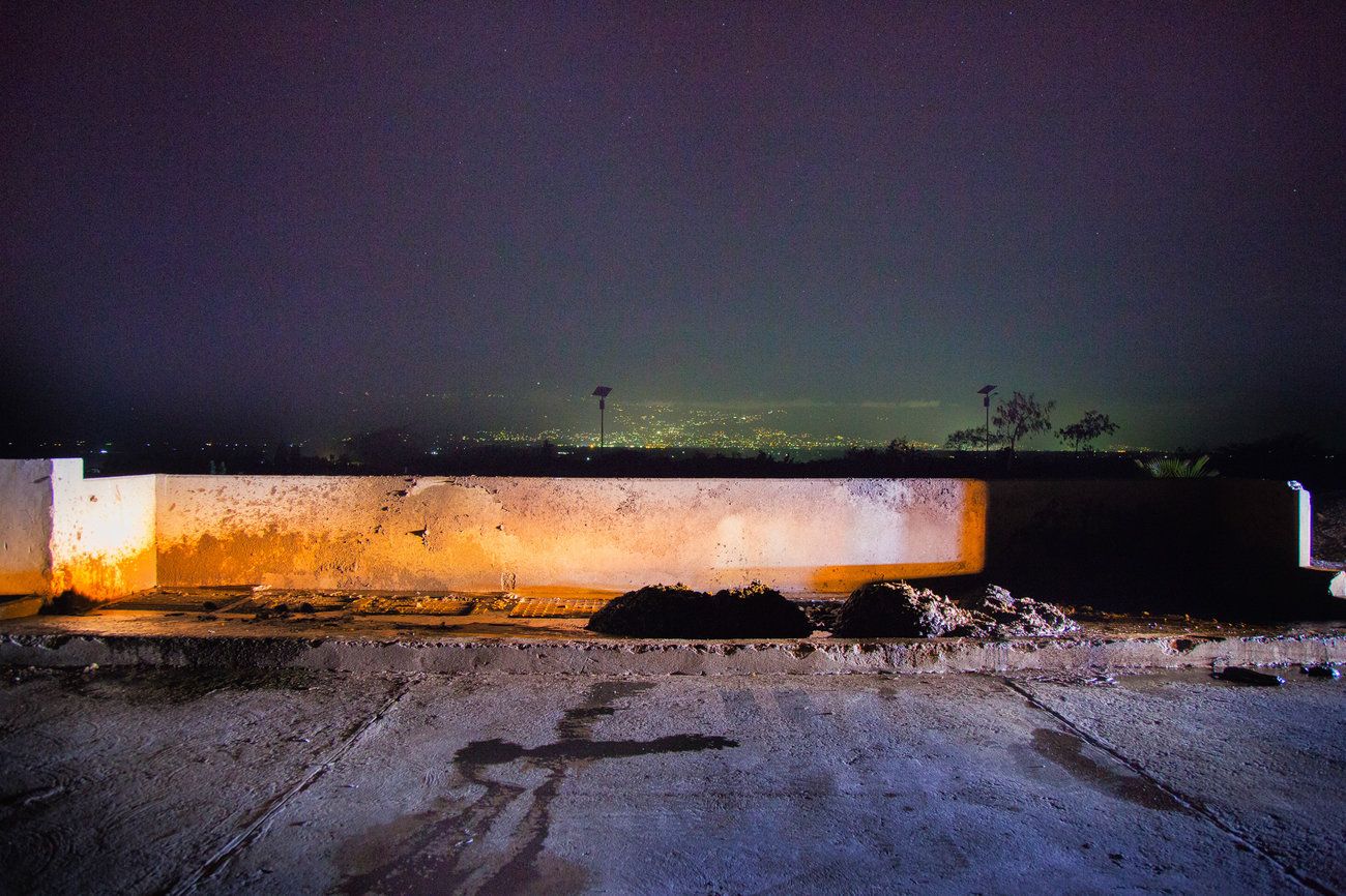 Piles of human waste are left at the Morne a Cabrit sewage treatment plant. The latrine cleaners who dumped them work in the dark because of intense stigma associated with their profession. Image by Marie Arago/NPR. Haiti, 2017.