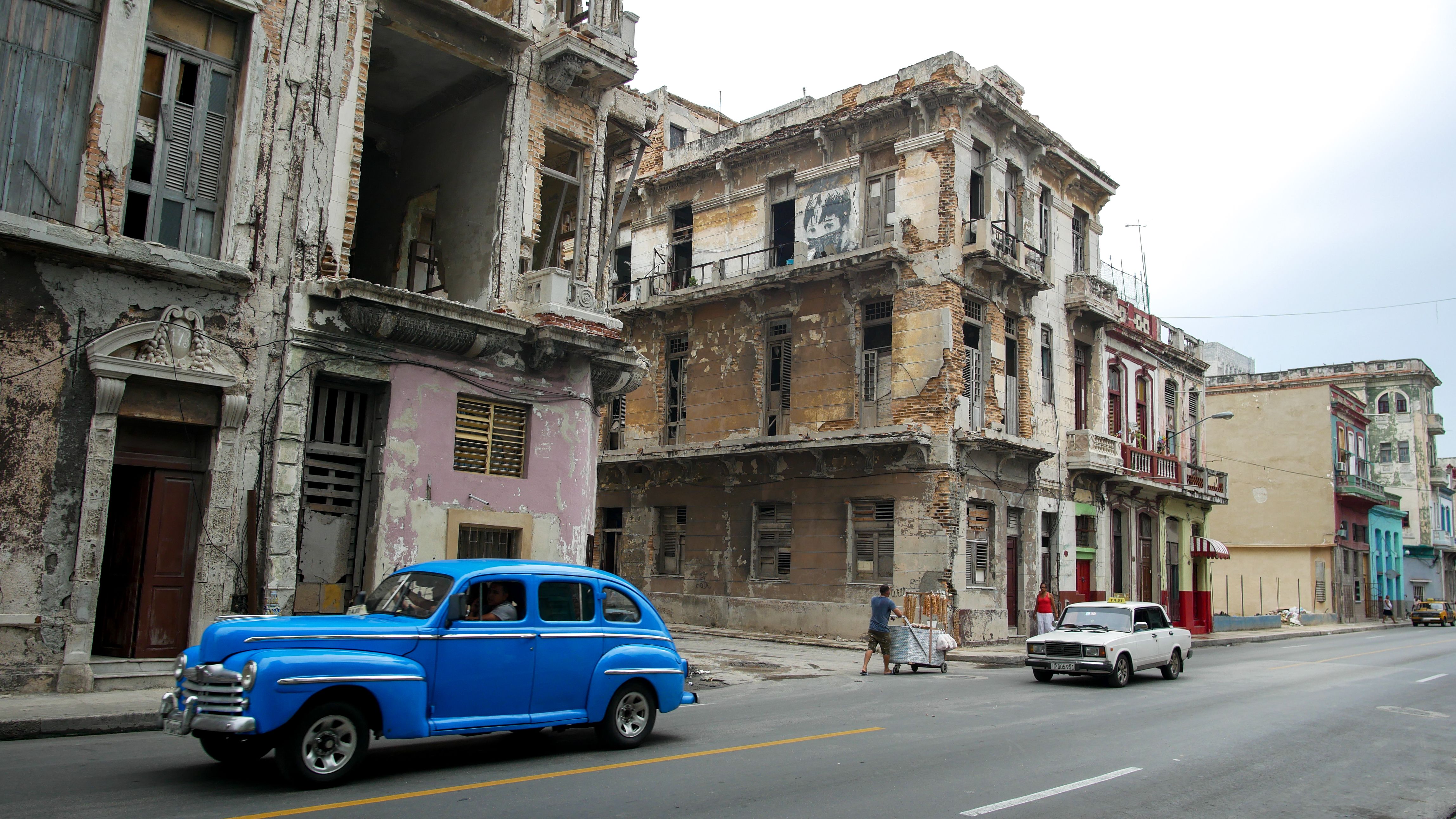Buildings a block from Havana’s famed Malecón, a seaside walkway stretching more than four miles, show the ravages of time and weather. Image by Tracey Eaton. Cuba, 2018.