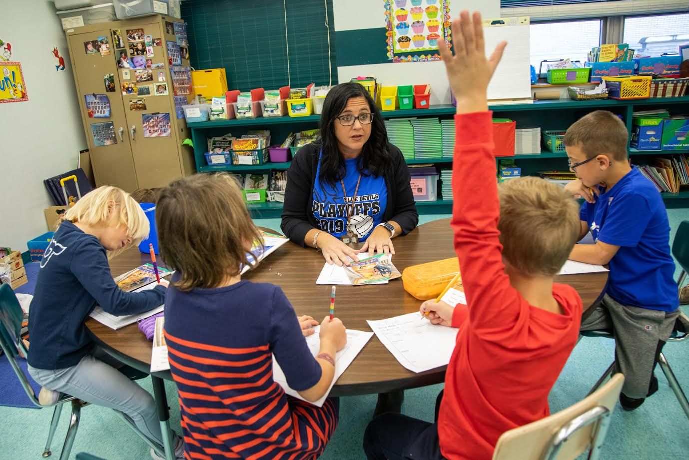 First-grade teacher Niva Vargo works with her students on a reading activity at David Leech Elementary in Leechburg. Image by Andrew Rush. United States, 2019.