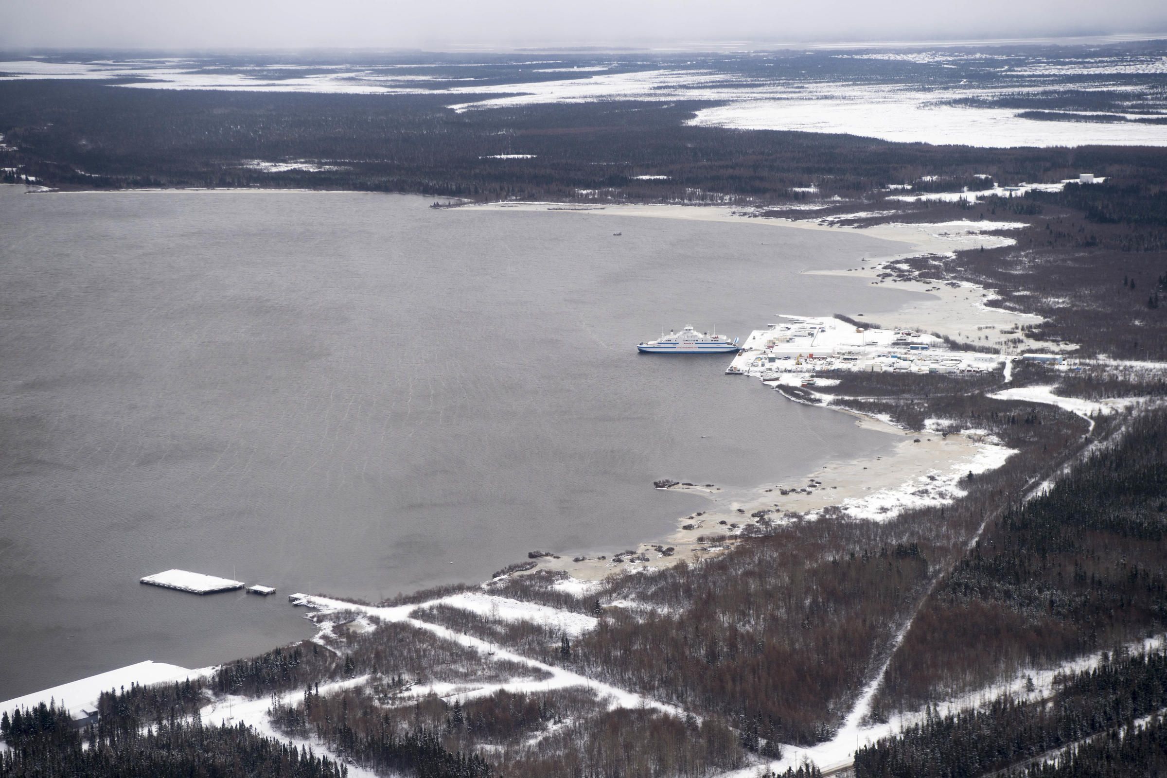 The waters from the Churchill River converge with the water from Lake Melville near Happy Valley-Goose Bay, Labrador on November 9, 2019. The ferry waits to leave the dock headed for the remote Inuit towns north of Lake Melville. Image by Michael G. Seamans. Canada, 2019.