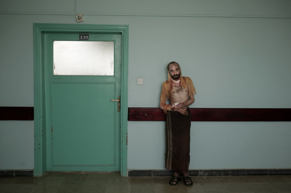 Monir al-Sharqi rests after taking a walk at the Marib General Hospital. Image by Nariman El-Mofty for AP News. Yemen, 2018.