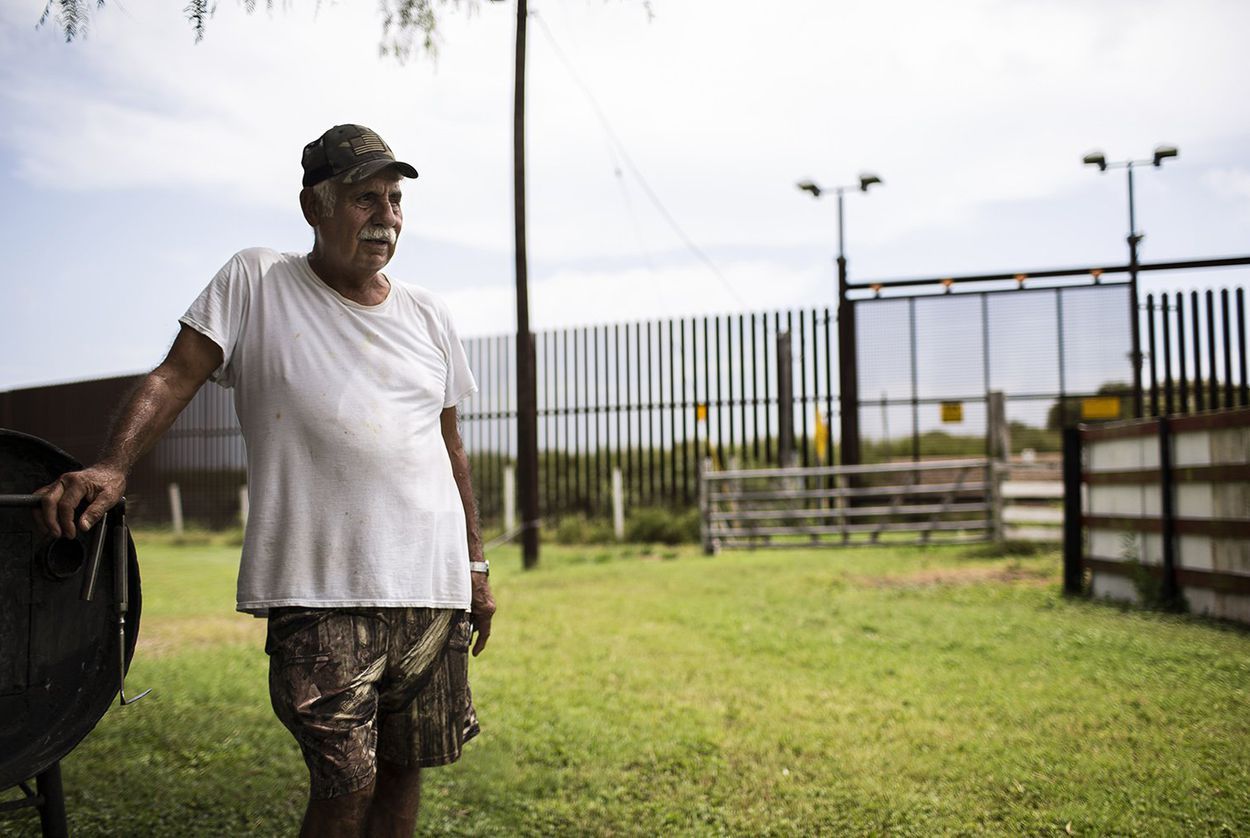 Juan Cavazos at his home on Oklahoma Avenue in Brownsville, Texas. The federal government took part of the former teacher's land to build the border fence. Image by Martin do Nascimento. United States, 2017.