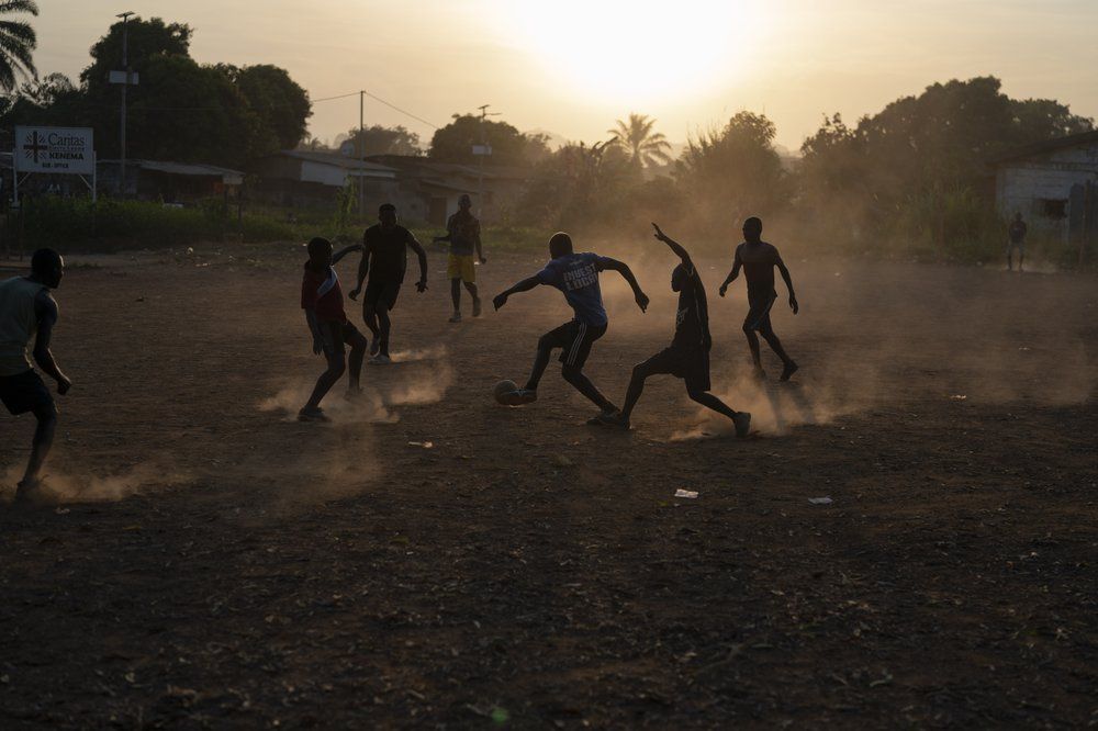 Youths play soccer during as the sun sets in Koidu, district of Kono, Sierra Leone, Tuesday, Nov. 24, 2020. Image by Leo Correa/AP Photo. Sierra Leone, 2020.
.