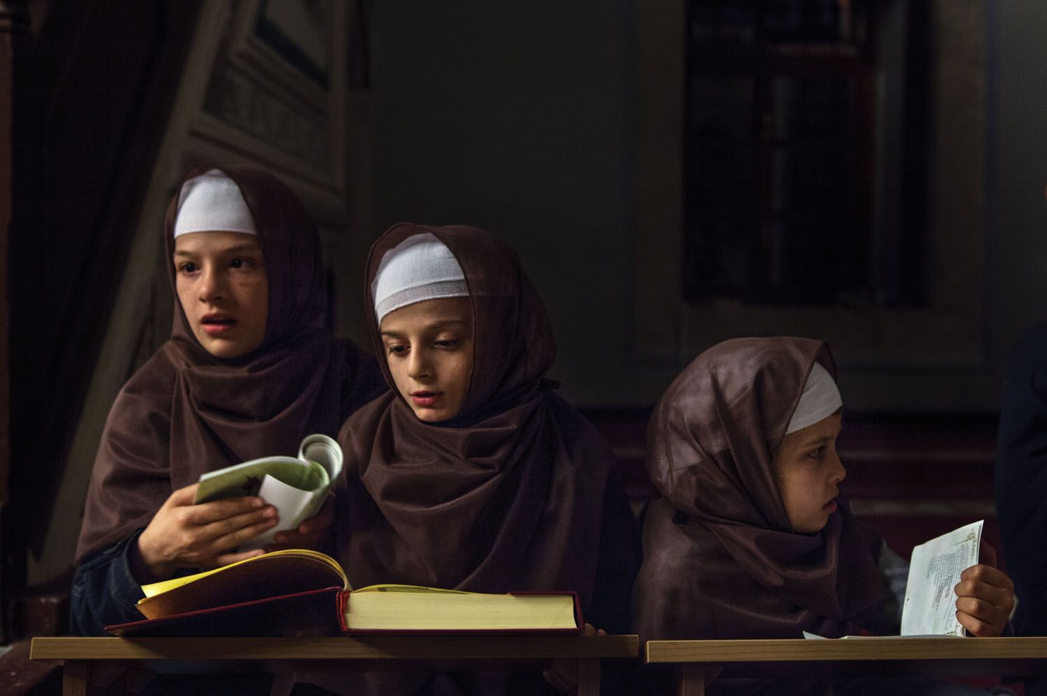 Albanian children studying the Koran. Image by Monika Bulaj. Kosovo, 2013.