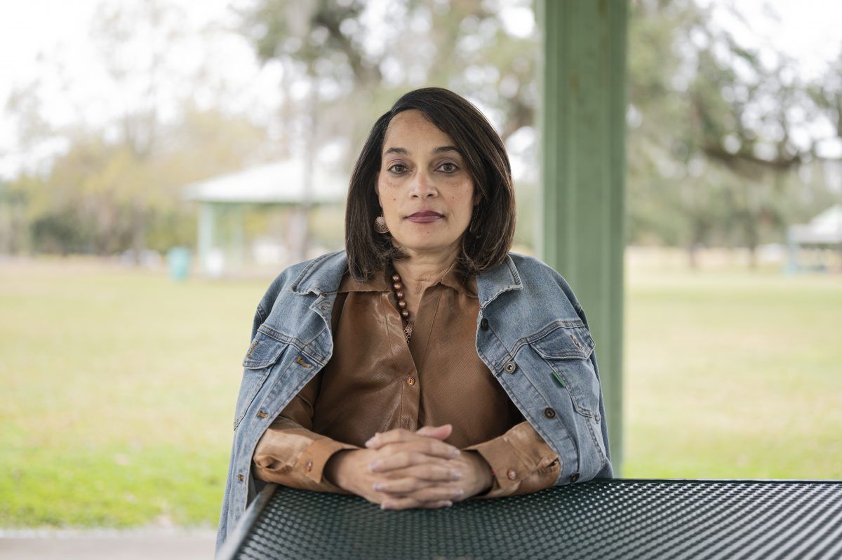Dr. Lisa Morgan at Girard Park near where she is staying after her home in Lake Charles was damaged during back-to-back hurricanes in August and October. Image by Katie Sikora. United States, 2020.
