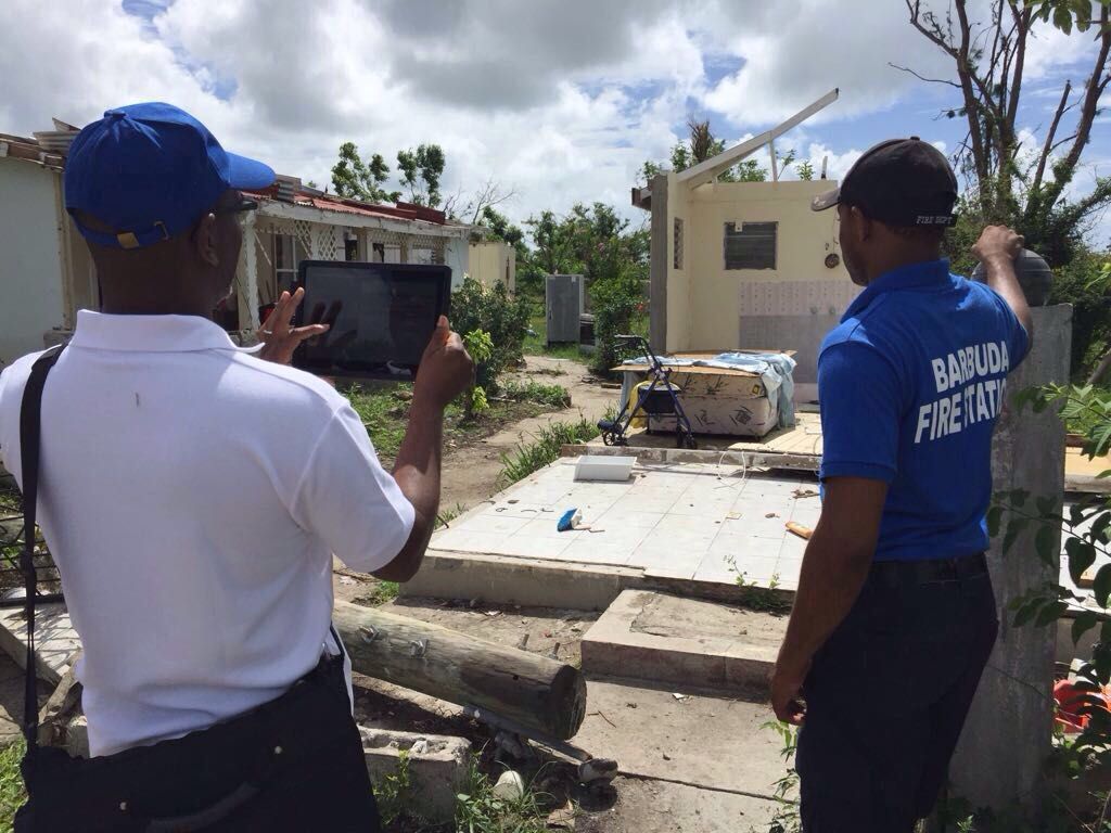 Workers gather data using the Microsoft Building Damage Assessment app in Barbuda. The island was home to 1,600 people, all of whom were evacuated after Hurricane Irma. Image courtesy United Nations Development Program. Barbuda, 2017.