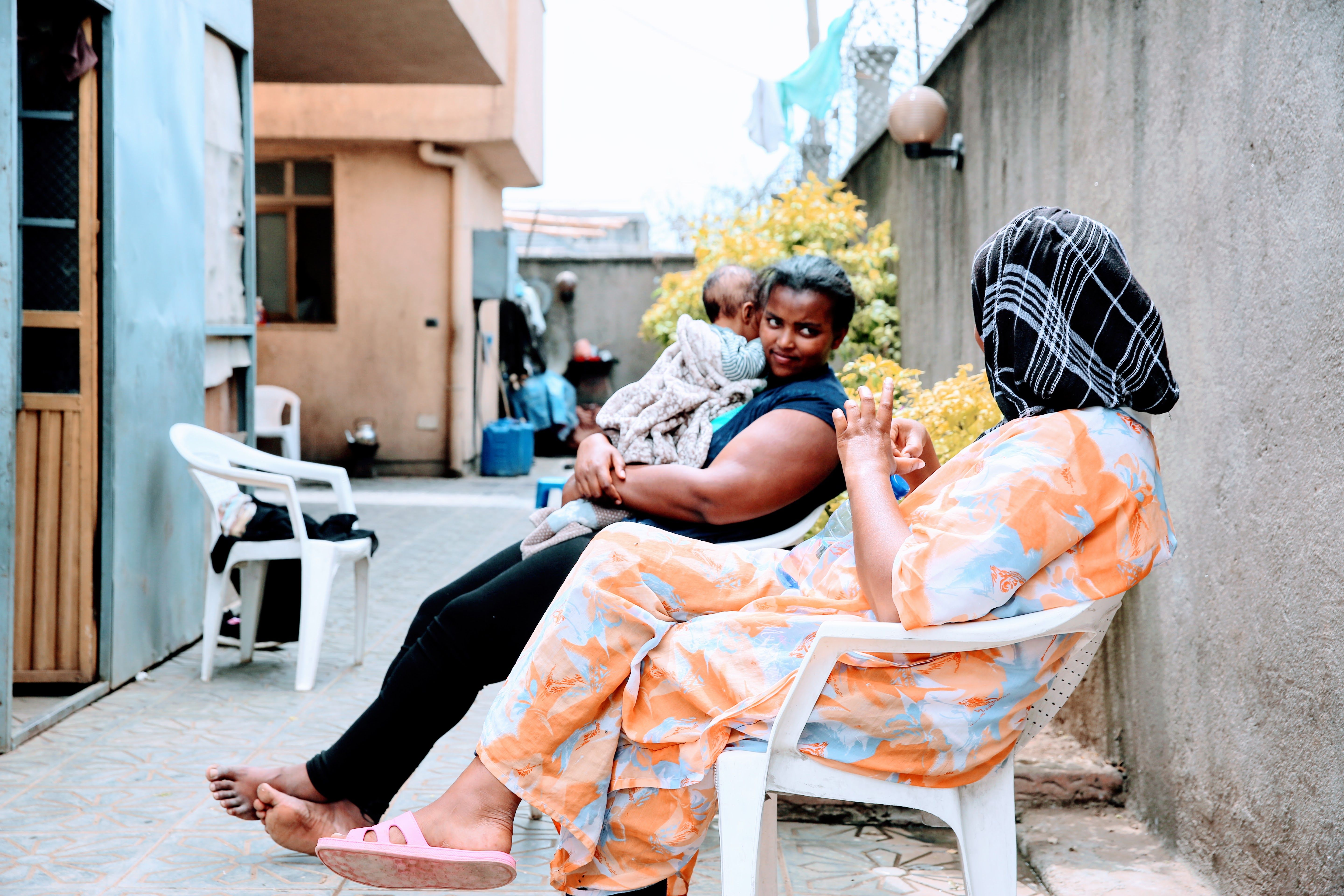 Women being cared for talk on the back patio of Agar. Image by Meklit Mersha. Ethiopia, 2019.