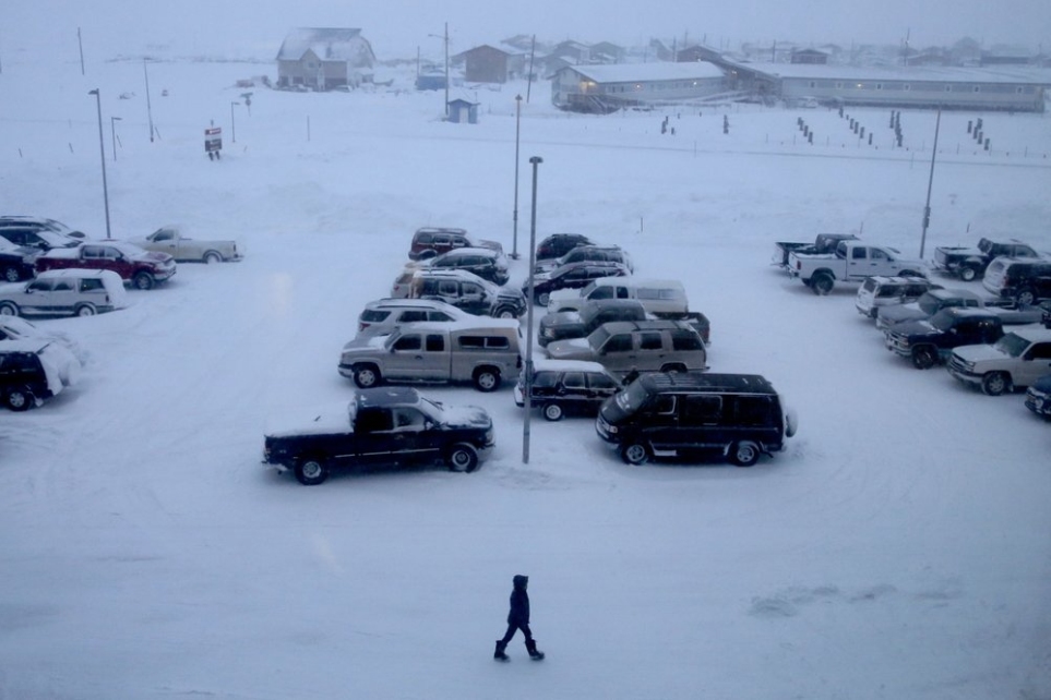 In this Feb. 22, 2019, photo, a woman walks past the entrance of Norton Sound Regional Hospital in Nome, Alaska. The hospital serves Nome and surrounding villages of the Bering Strait region. As far back as 2015, a group of Alaska Native survivors of sexual and domestic violence circulated an email among community groups, tribal leaders and others, saying that many survivors' cases had been mishandled or not investigated at all. Some believed their complaints were dismissed due to racial bias. Image by Wong Maye-E. United States, 2019.