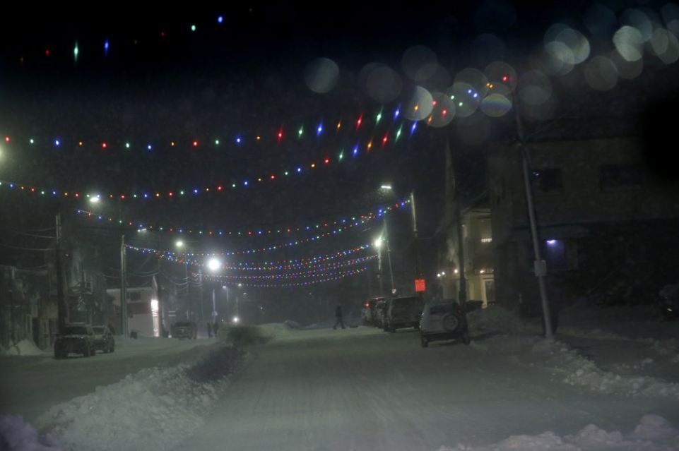 In this Feb. 22, 2019, photo, a man walks down a snowy street in Nome, Alaska. Advocates against sexual violence say police and prosecutors in many small towns and rural counties still don't show enough commitment to investigating sexual assaults _ and in some cases meet reports of rape with intense disbelief. Image by Wong Maye-E. United States, 2019.