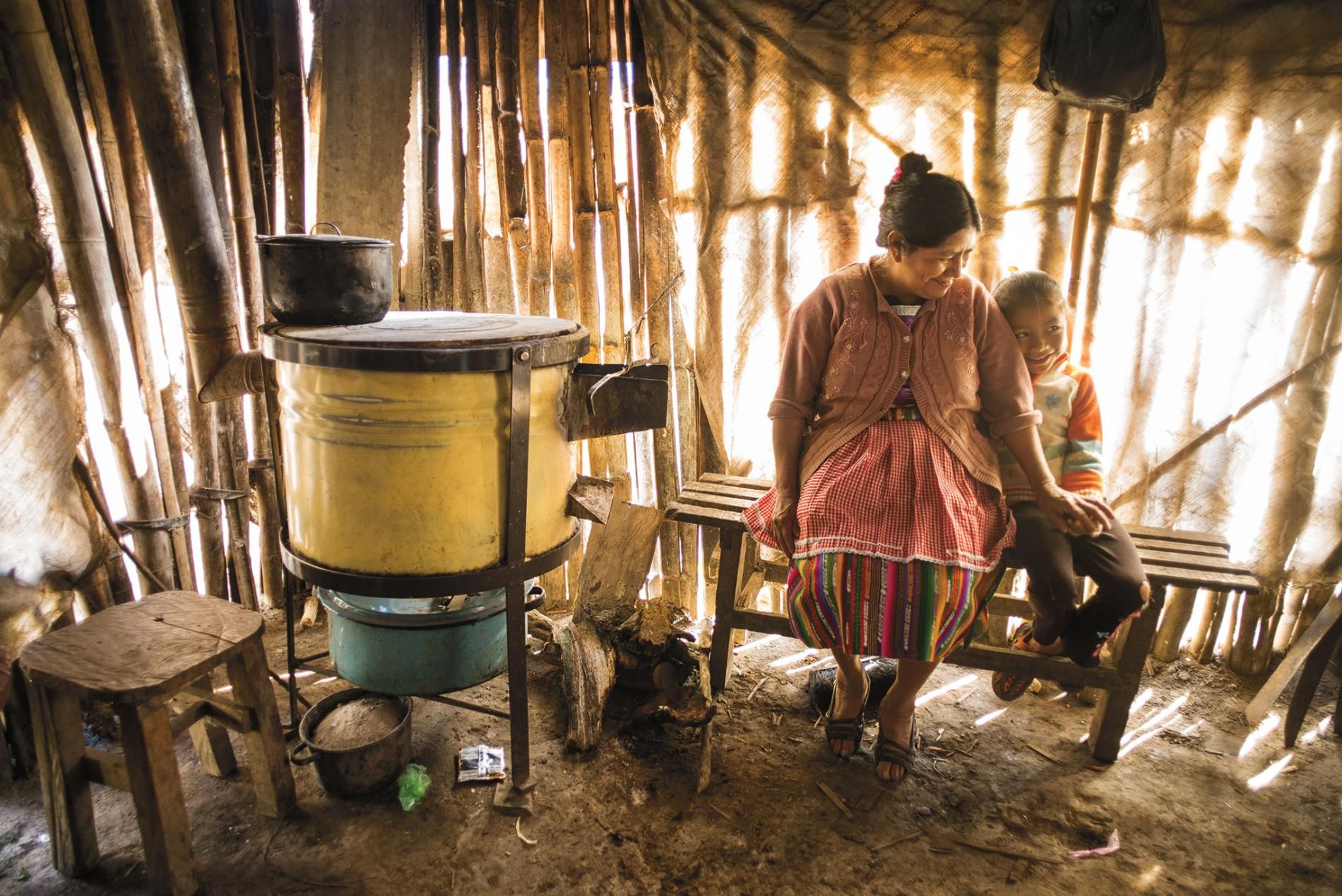 In Jocotenango, Guatemala, Rosa de Sapeta's family used to avoid her smoke-filled kitchen. But since an aid group helped her replace the open fire with a cleaner burning stove, she says, "I have company while I cook." Image by Lynn Johnson. Guatemala, 2017.