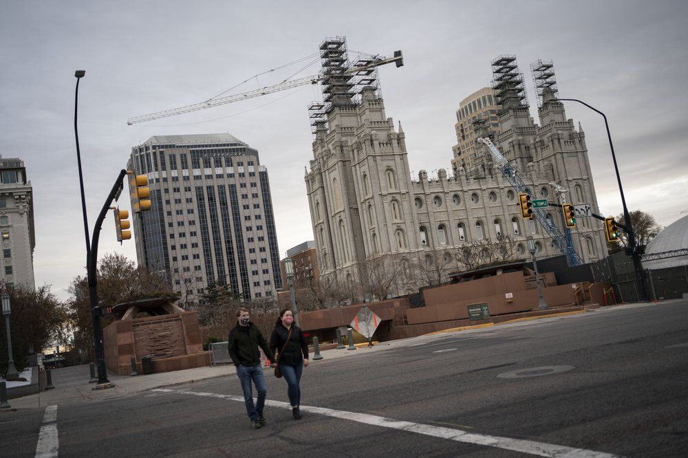 The Salt Lake Temple of The Church of Jesus Christ of Latter-day Saints is seen under construction in Salt Lake City, Sunday, Nov. 15, 2020. While the church has traditionally been overwhelmingly conservative and Republican, today there's also an increasingly large strain of liberal members. The church has also begun to directly address its history of racism, including a ban on Black priests that it lifted four decades ago. Image by Wong Maye-E / AP Photo. United States, 2020.