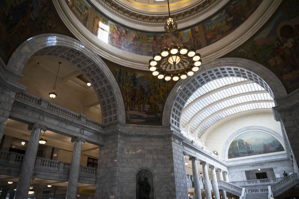 The interior of the Utah State Capitol in Salt Lake City is photographed on Monday, Nov. 16, 2020. When it comes to politics, Utah has long claimed things are different here. Political viciousness is for other places, many politicians will tell you. Legislators are more polite, more willing to compromise. The deep conservatism, the folklore says, includes a powerful strain of compassion. Image by Wong Maye-E / AP Photo. United States, 2020.