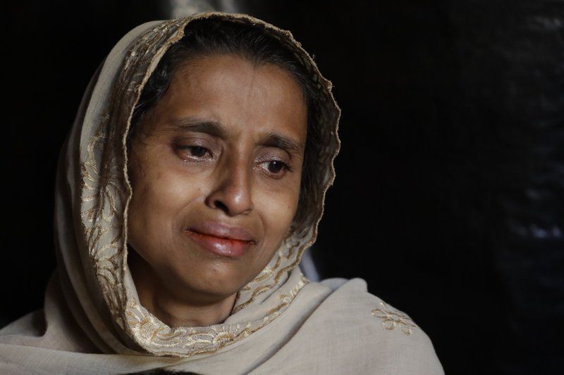 In this Sunday Nov. 26, 2017, photo, Jamila Begum, 35, cries when talking about how members of Myanmar’s armed forces accused of massacring civilians in her village Maung Nu, in Myanmar’s Rakhine State, killed her son and husband during an interview with The Associated Press in Kutupalong refugee camp in Bangladesh. More than 650,000 Rohingya Muslims have fled to Bangladesh from Myanmar since August, and many have brought with them stories of atrocities committed by security forces in Myanmar, including an Aug. 27 army massacre that reportedly took place in the village of Maung Nu. Image by Wong Maye-E. Bangladesh, 2017.