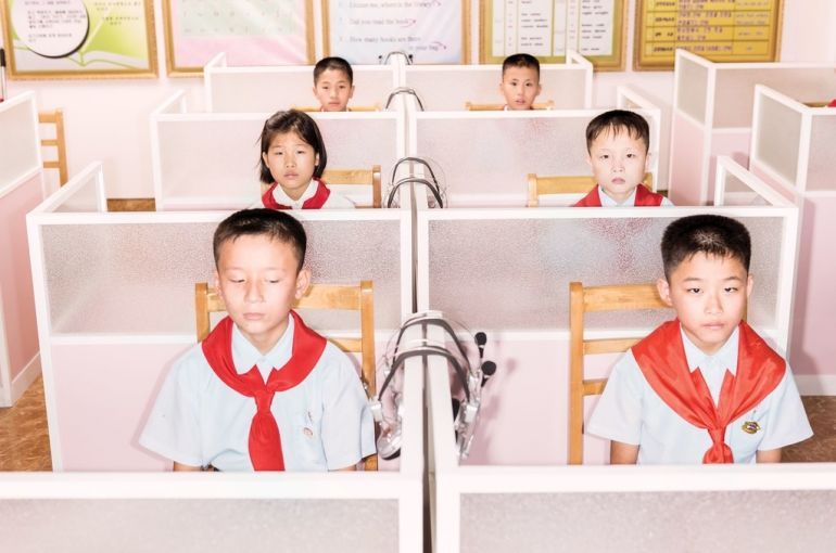 Students at the Pyongyang Orphans’ Secondary School, which is housed in a new brick-and-steel complex. In a class of ten- and eleven-year-olds, one boy asked, “Why is America trying to provoke a war with us?” Image by Max Pinckers/The New Yorker. North Korea, 2017.