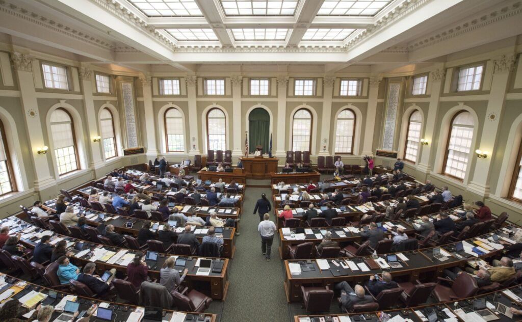 The Maine House of Representatives argues a bill on the floor aimed at more analysis of the proposed New England Clean Energy Connect project at the State House in Augusta on June 4, 2019. Image by Michael G. Seamans. United States, 2019.