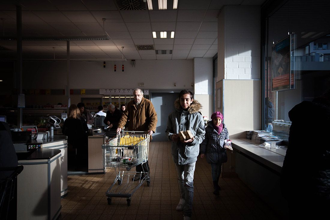Milad shops at a Dusseldorf supermarket with one of his sisters. He had never seen a supermarket before coming to Germany. “There are too many options in this country,” he told Markosian. Image by Diana Markosian. Germany, 2017.