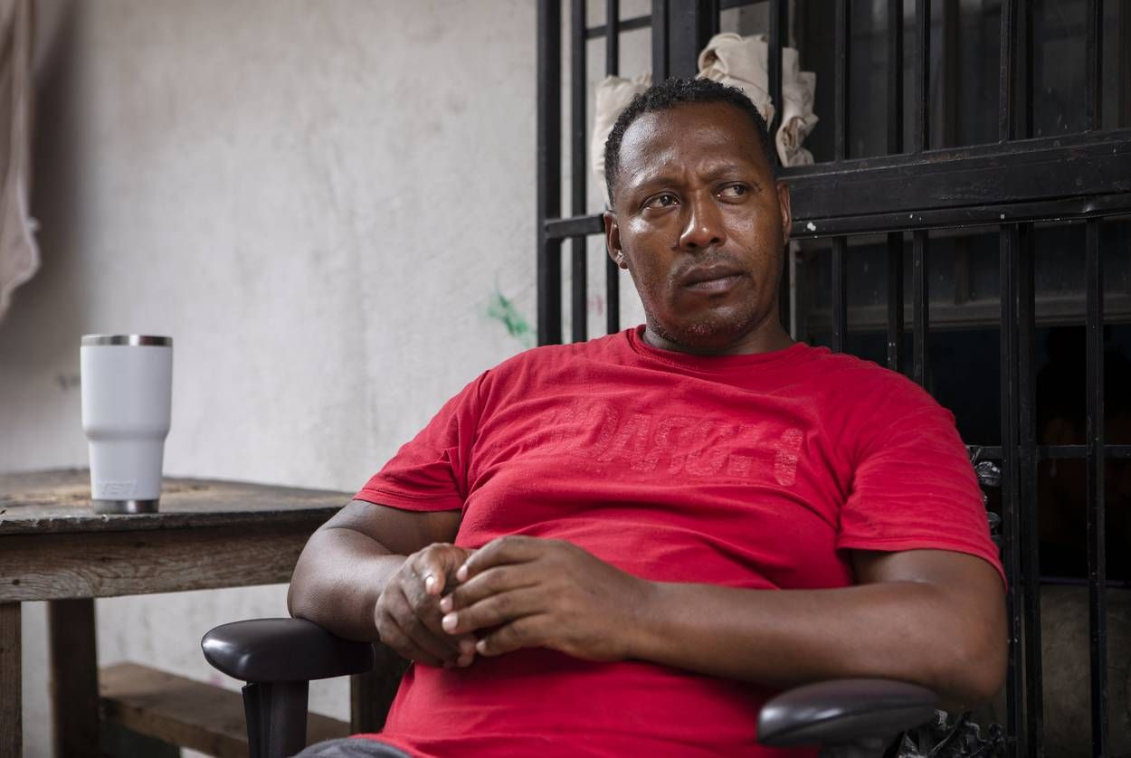 Geovanys Garcia, a Cuban migrant, sits in the courtyard of an apartment complex in Nuevo Laredo. Garcia fears returning to Cuba and is waiting to claim asylum in the United States. Image by Miguel Gutierrez Jr. United States, 2019.