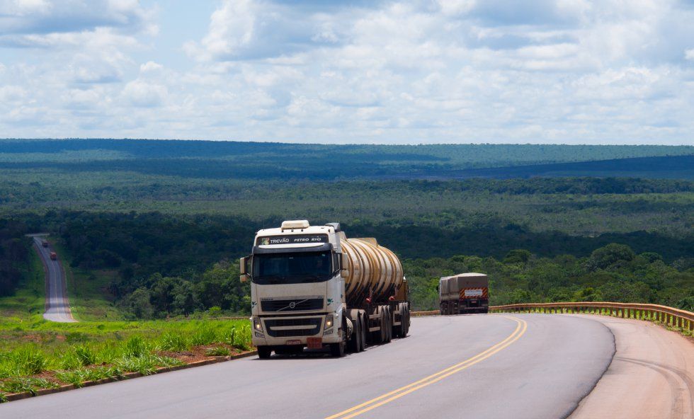 Highway BR-163, used to transport soy, transects the forest in the state of Pará. The "grain train" (Ferrograo) is meant to advance in parallel to this road, instigating fears of deforestation. Image by Melissa Chan. Brazil, 2019. 