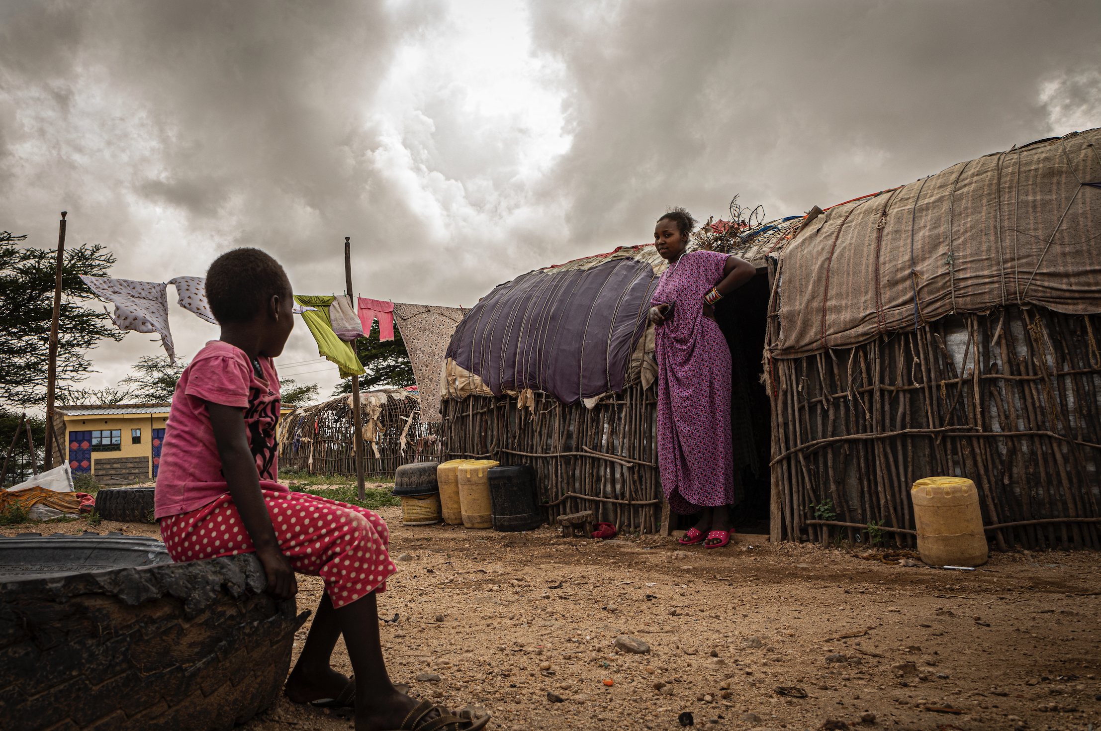 Vicky, 18, with her sister at their family home in Laisamis, Kenya. Image by Will Swanson. Kenya, 2020.