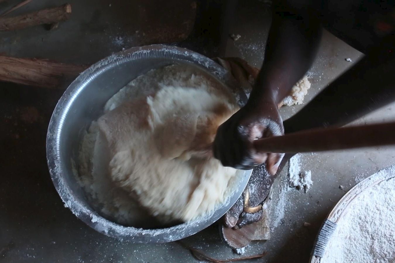 Nsima, the country’s staple food, is a stiff porridge of maize flour that has to be prepared fresh for every meal. Image by Nathalie Bertrams. Malawi, 2017.