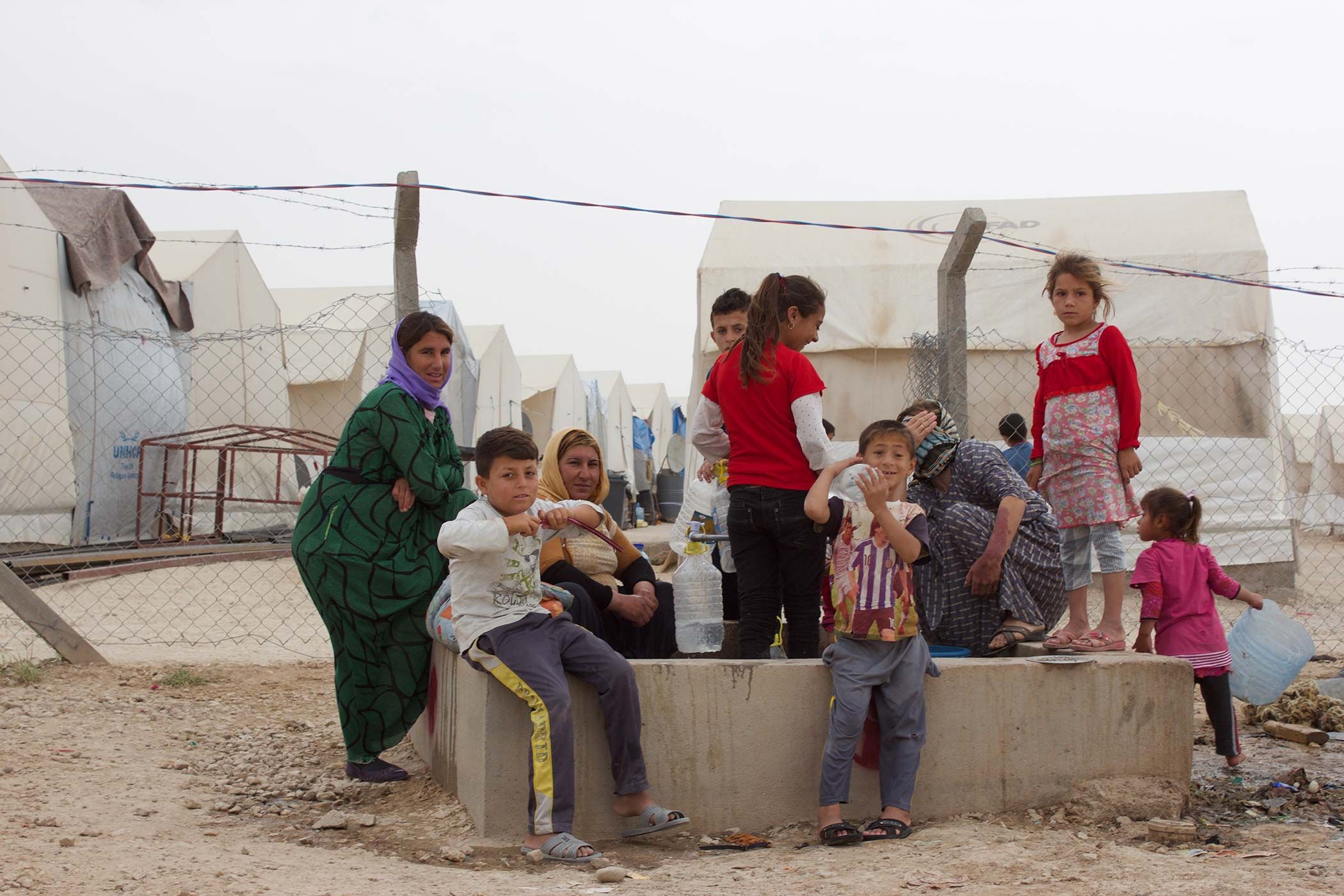 One of many camps for internally displaced people in Iraq. Forced to flee their homes when ISIS advanced on their villages in 2014, most Yazidis from the Sinjar region of Iraq remain in camps. Image by Emily Feldman. Iraq, 2015.