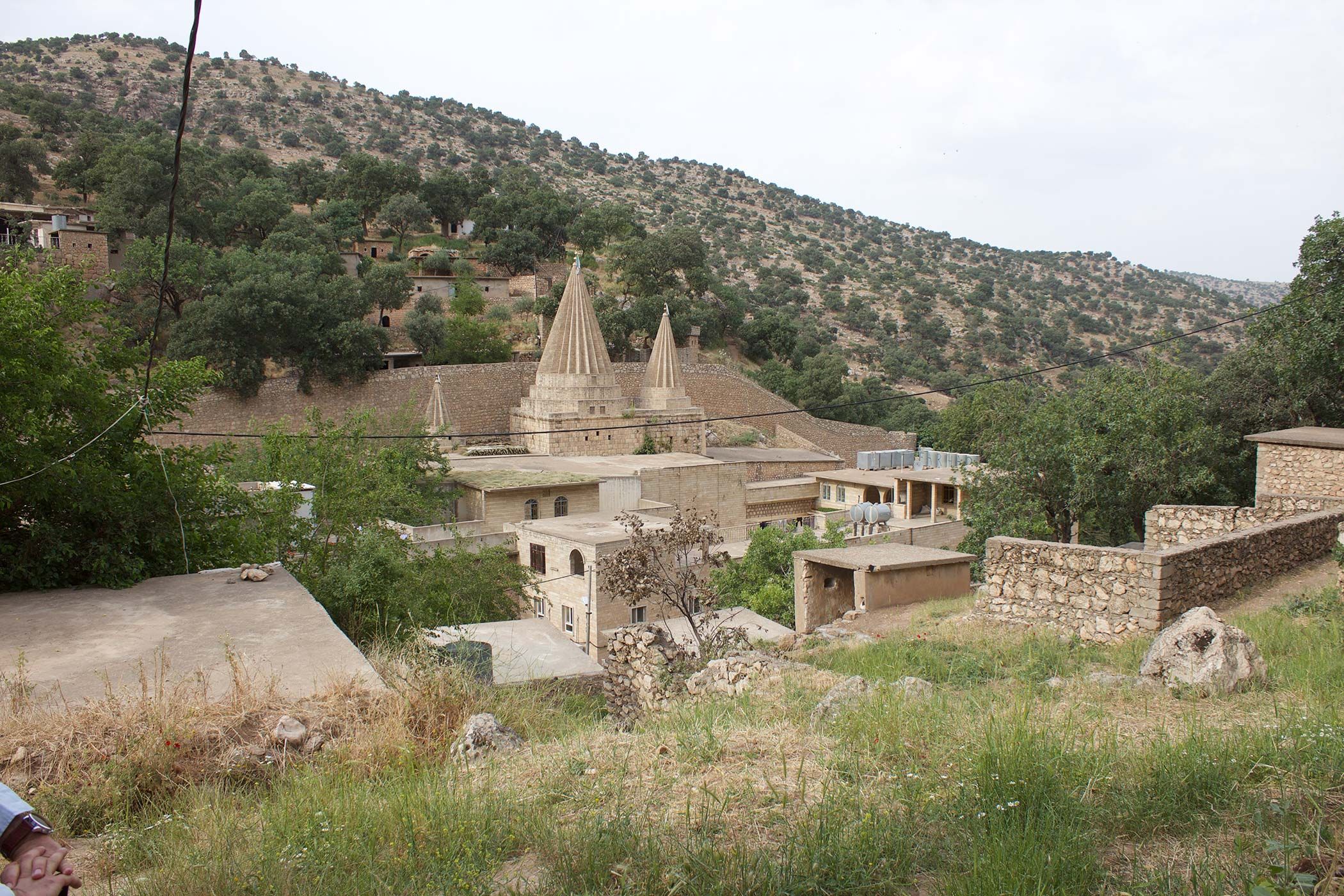 The valley of Lalish in northern Iraq is home to one of the most revered sanctuaries in the Yazidi religion. Participants in the German refugee program stopped at the valley of Lalish for blessings before leaving Iraq. Image by Emily Feldman. Iraq, 2015.