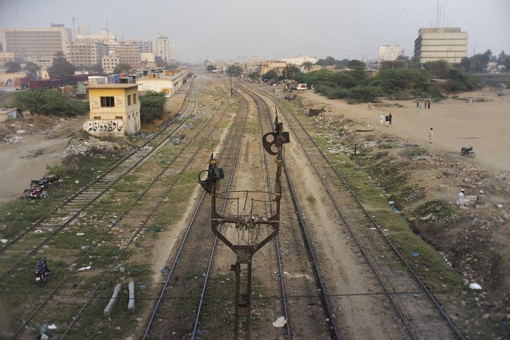 Tracks Under Karachi Port Trust Interchange, Karachi, Pakistan. Still image from KCR. Image by Ivan Sigal. Pakistan, 2017.