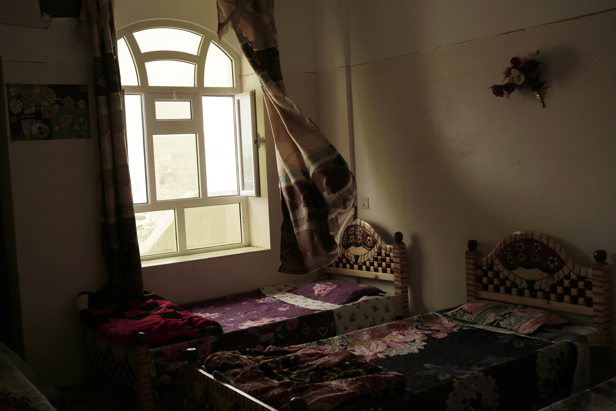This July 28, 2018, photo shows a bedroom at the Rehabilitation Of Children Recruited and Impacted By War in Yemen Project center in Marib, Yemen. The Houthis have inducted 18,000 child soldiers into their rebel army since the beginning of the war in 2014, a senior Houthi military official acknowledged to The Associated Press. Image by Nariman El-Mofty / AP News. Yemen, 2018.