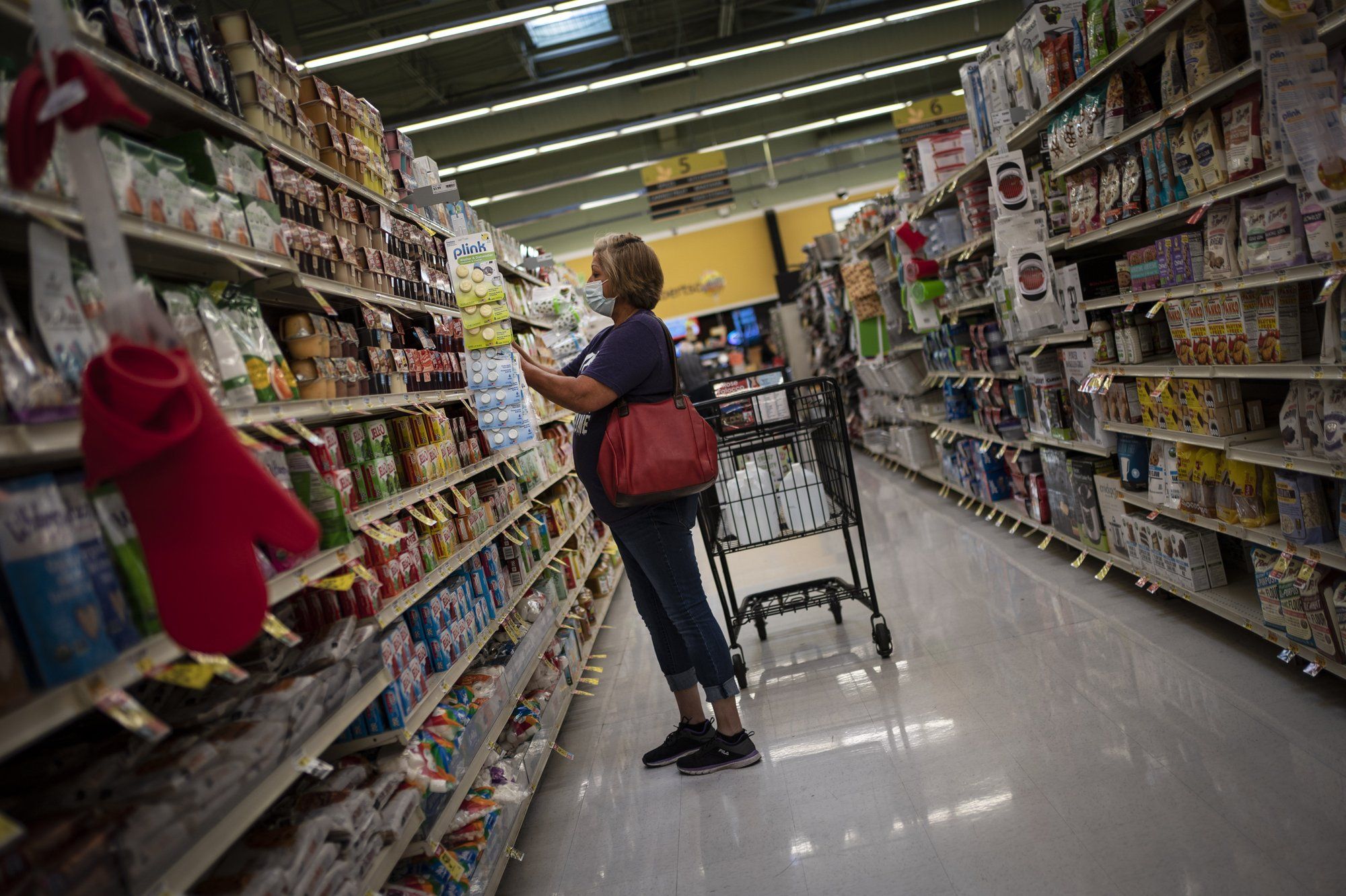 Norma Flores, 54, shops for snacks for her grandchildren at a store near her home in Henderson, Nevada, Tuesday, Nov. 10, 2020. Image by Wong Maye-E / AP Photo. United States, 2020.