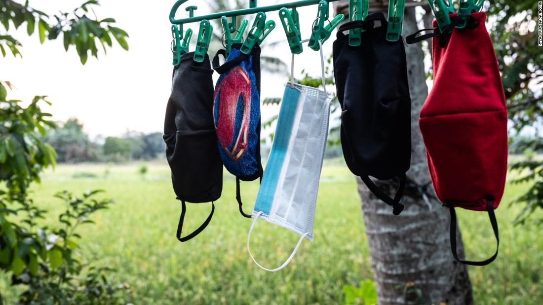 April Abrias' facemasks are hung out to dry after being washed so they can be reused. Image by Xyza Cruz Bacani. Philippines, 2020.