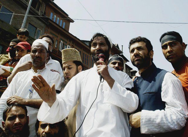 Agence France-Presse/Getty Images Yasin Malik, chairman of the Jammu and Kashmir Liberation Front, addresses a demonstration in Srinagar. The former militant leader has renounced violence and embraced the new generation of protesters.