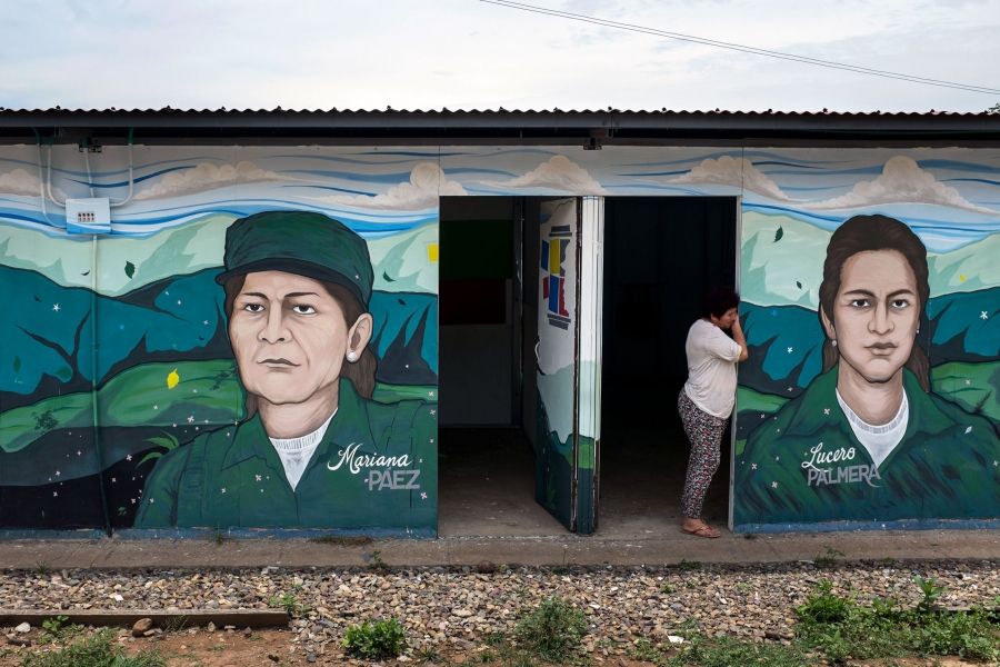 Ex-fighter Elisa Castro stands in an entrance of the FARC's memory museum at the Pondores reintegration camp in La Guajira, Colombia. Image by Fabio Cuttica/The World. Colombia, 2018.
