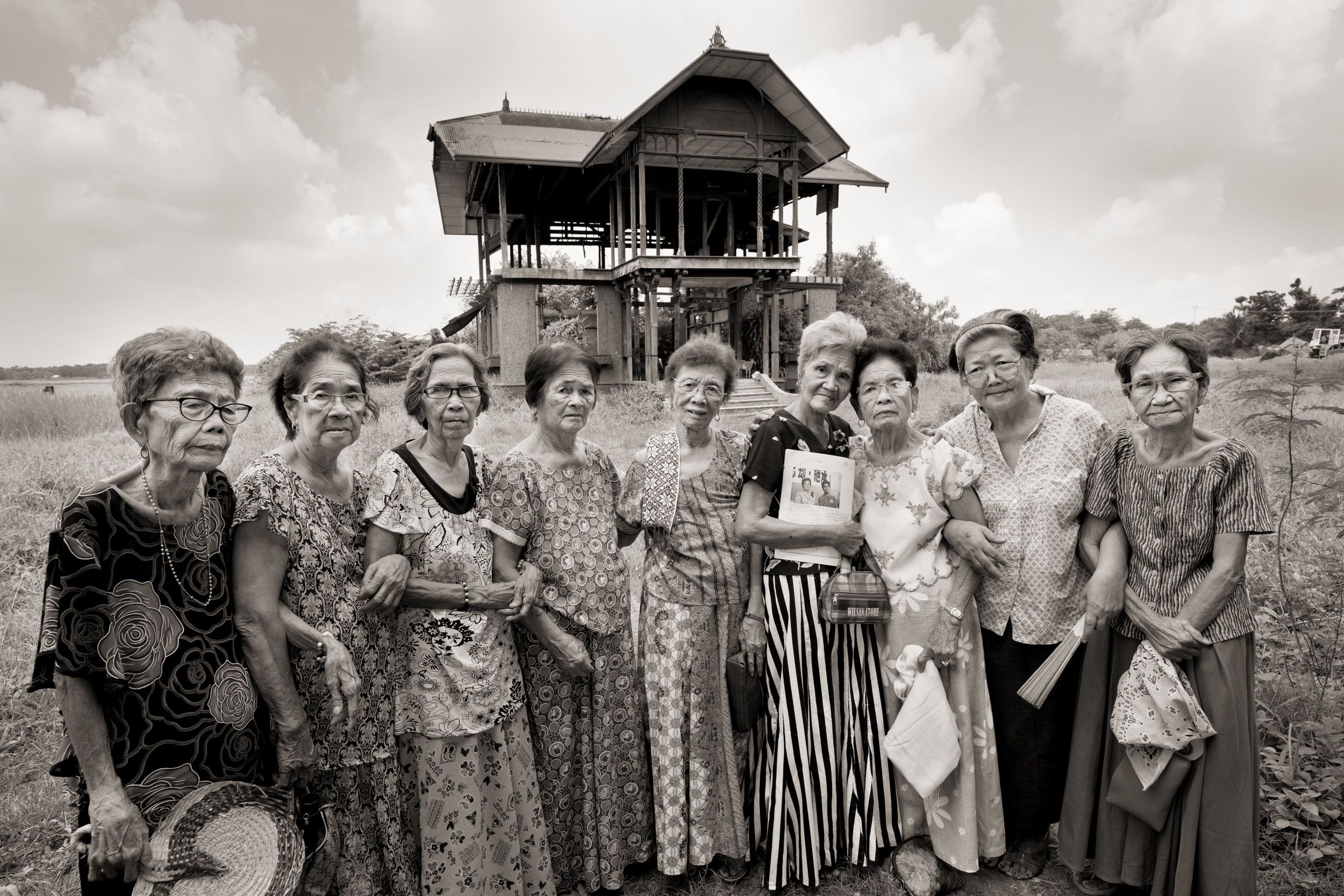 The Malaya Lolas are a group of women who were sexually assaulted as children by Japanese soldiers in Pampanga province in the Philippines during World War II. Left to right are Belen Alarcon Culala, Catalina Yarbut Manio, Lydia Alonzo Sanchez, Francia Aga Buco, Pilar Quilantang Galang, Isabelita Vinuya, Maria Lalu Quilantang, Candelaria Soliman and Emilia dela Cruz Mangilit. Image by Cheryl Diaz Meyer. Philippines, 2019.