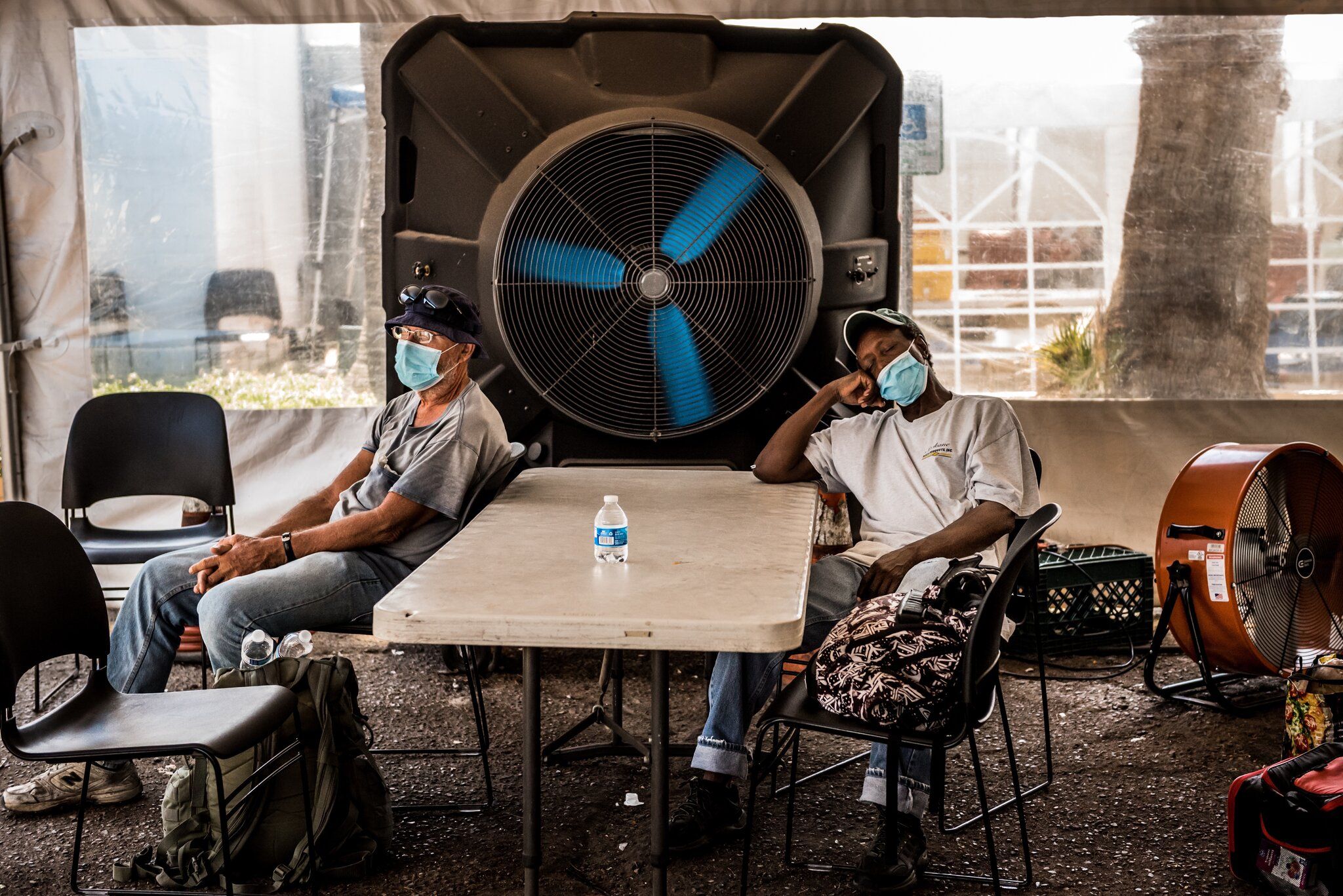PHOENIX. People at a cooling center during Arizona’s record-setting heat wave. Image by Meridith Kohut. United States, 2020.