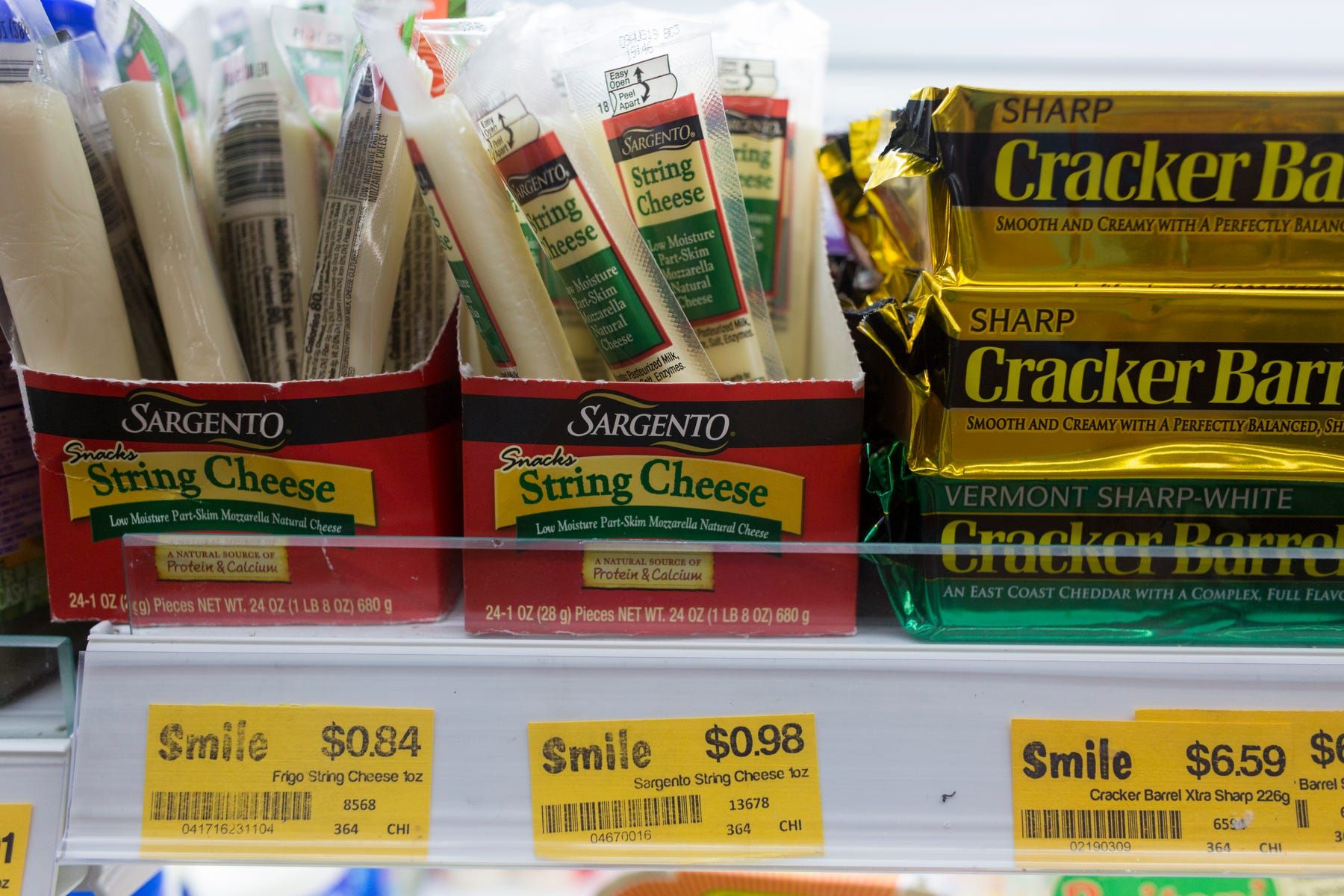 String cheese made by Plymouth, Wisconsin-based Sargento Foods Inc. is sold at a small grocery store central Phnom Penh. Image by Mark Hoffman. Thailand, 2019.