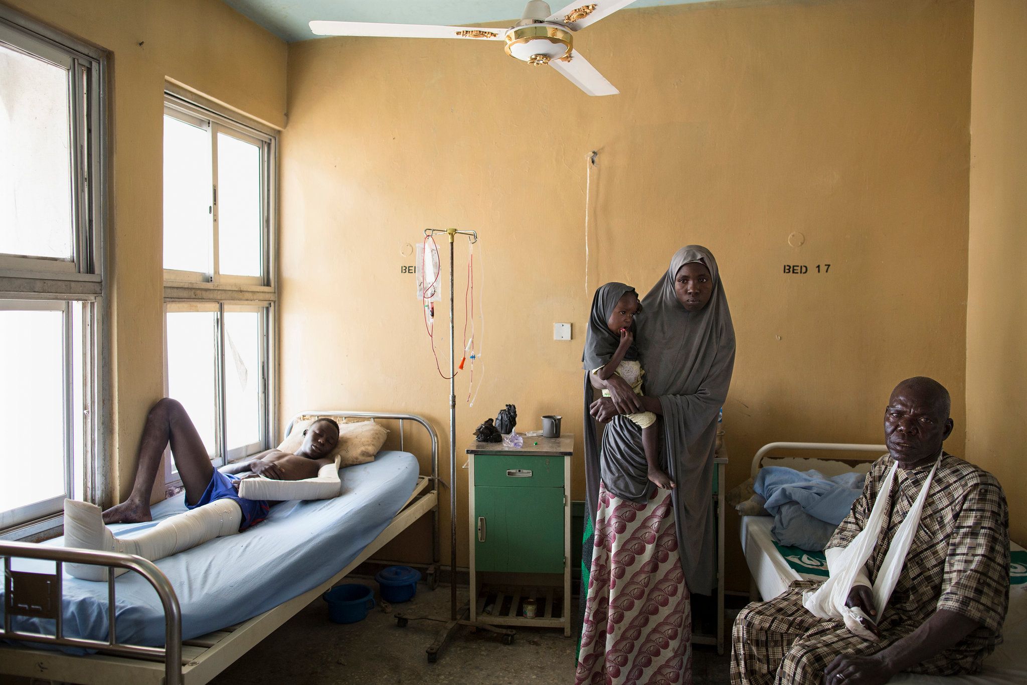 Makinta Dima, left, and Modu Dule, right, were shot by Boko Haram during a 30-minute attack on the Maiduguri-to-Damboa convoy that left more than 12 people dead. Image by Glenna Gordon. Nigeria, 2017.