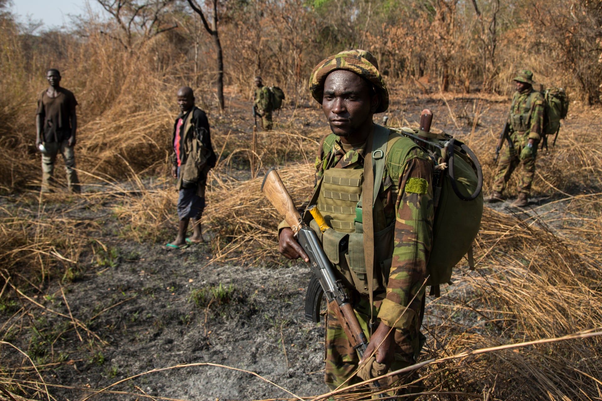 After days of pursuit, Chinko’s rangers have caught two suspected poachers deep in the Chinko bush. A raid on a their camp uncovered shotguns, machetes and carcasses of antelope, buffalo, crocodile, hippo and monkey. Image by Jack Losh. Central African Republic, 2018.