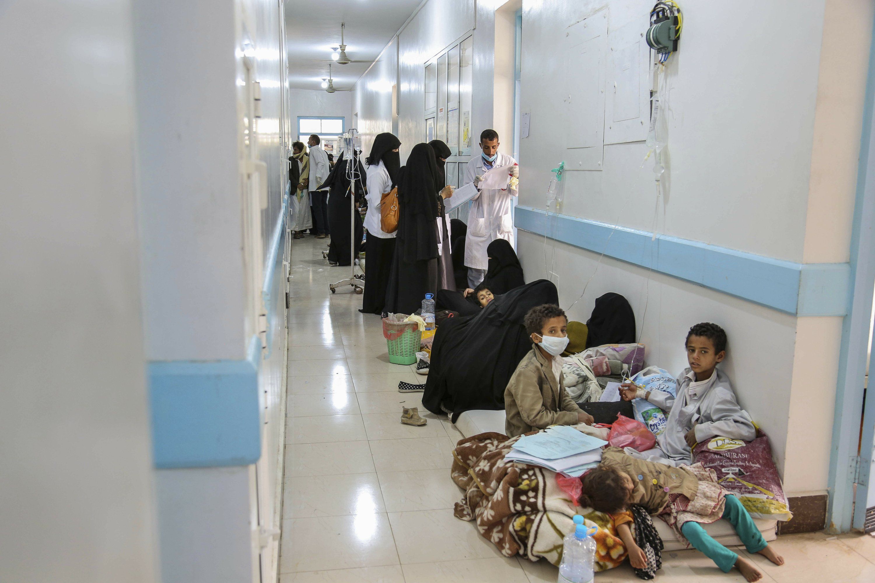 In this May 12, 2017 photo released by UNICEF, patients suffering from severe diarrhea and suspected of cholera, wait to receive treatment, at a hospital in Sanaa, Yemen. An Associated Press investigation finds that Yemen’s massive cholera epidemic was aggravated by corruption and official intransigence. The investigation has found that both the Iranian-backed Houthis rebels and their main adversary in the war—the U.S.—and Saudi-backed government that controls southern Yemen—impeded efforts by relief groups to stem the epidemic. Image courtesy of UNICEF via AP. Yemen, 2017.