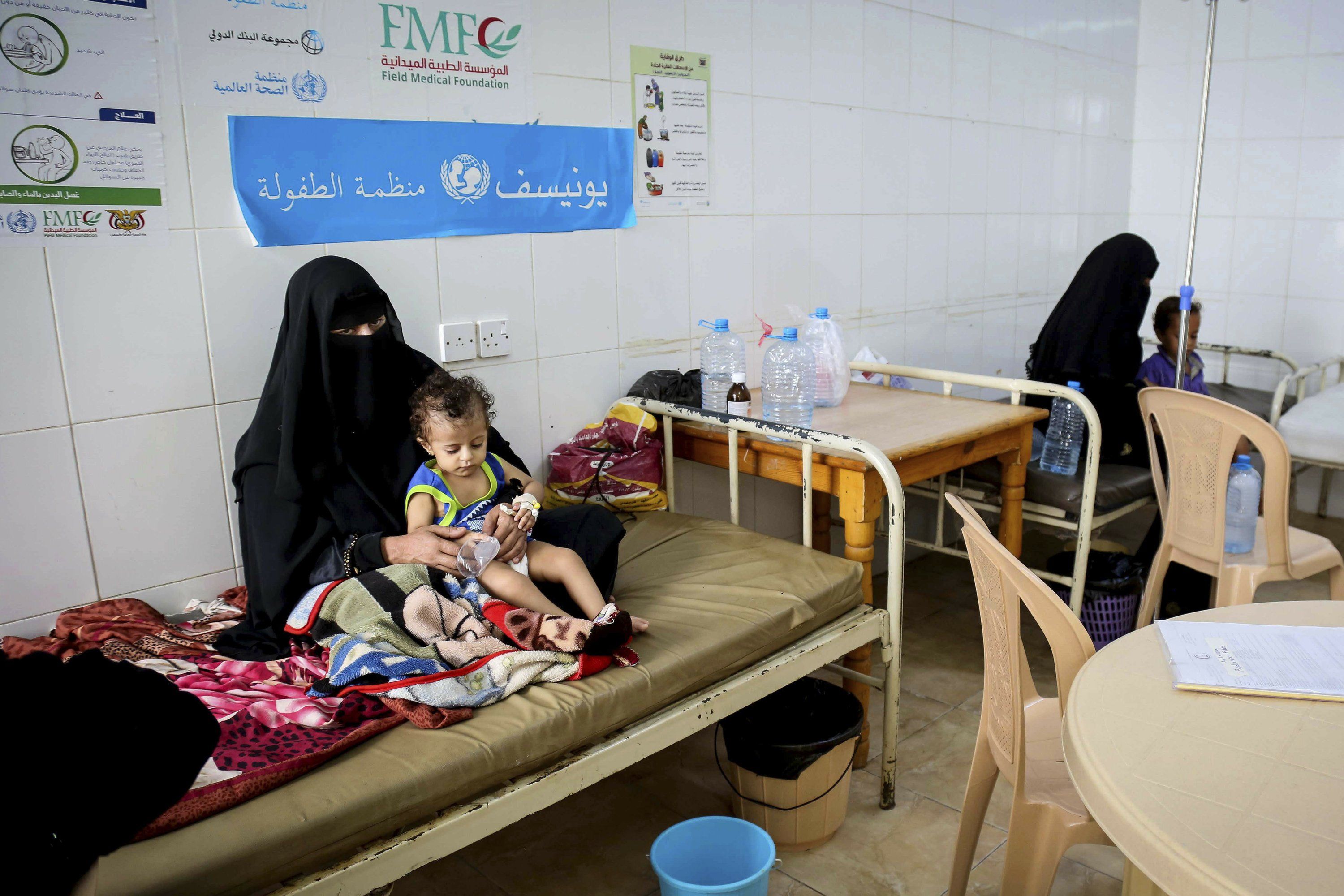 In this Sept. 16, 2017 photo released by UNICEF, children receive treatment for cholera at a hospital in Saada, Yemen. An Associated Press investigation finds that Yemen’s massive cholera epidemic was aggravated by corruption and official intransigence. The investigation has found that both the Iranian-backed Houthis rebels and their main adversary in the war—the U.S—and Saudi-backed government that controls southern Yemen— impeded efforts by relief groups to stem the epidemic. Image courtesy of UNICEF via AP. Yemen, 2017. 