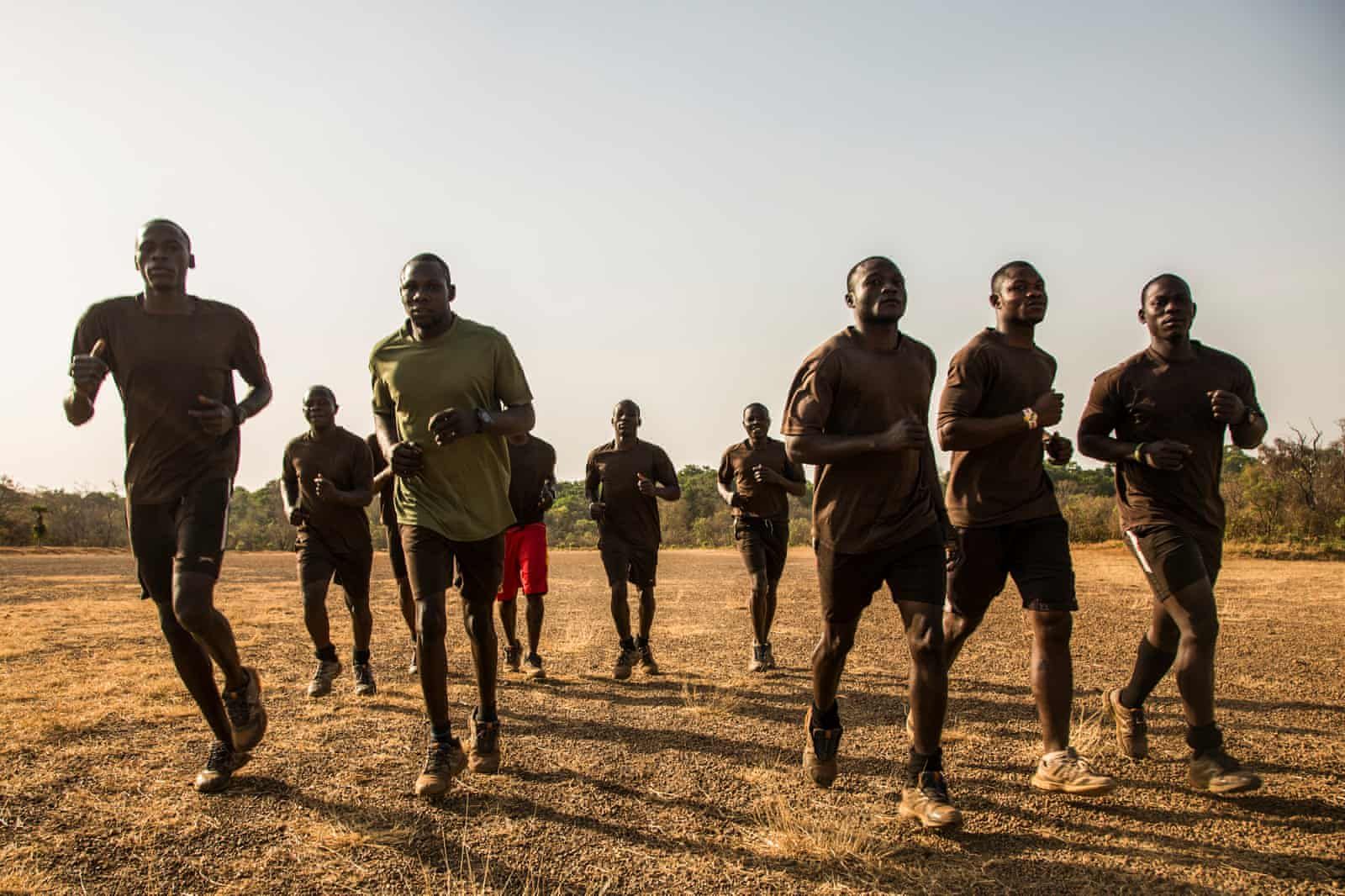 Rangers go on a morning jog down the main airstrip. Image by Jack Losh. Central African Republic, 2018. 