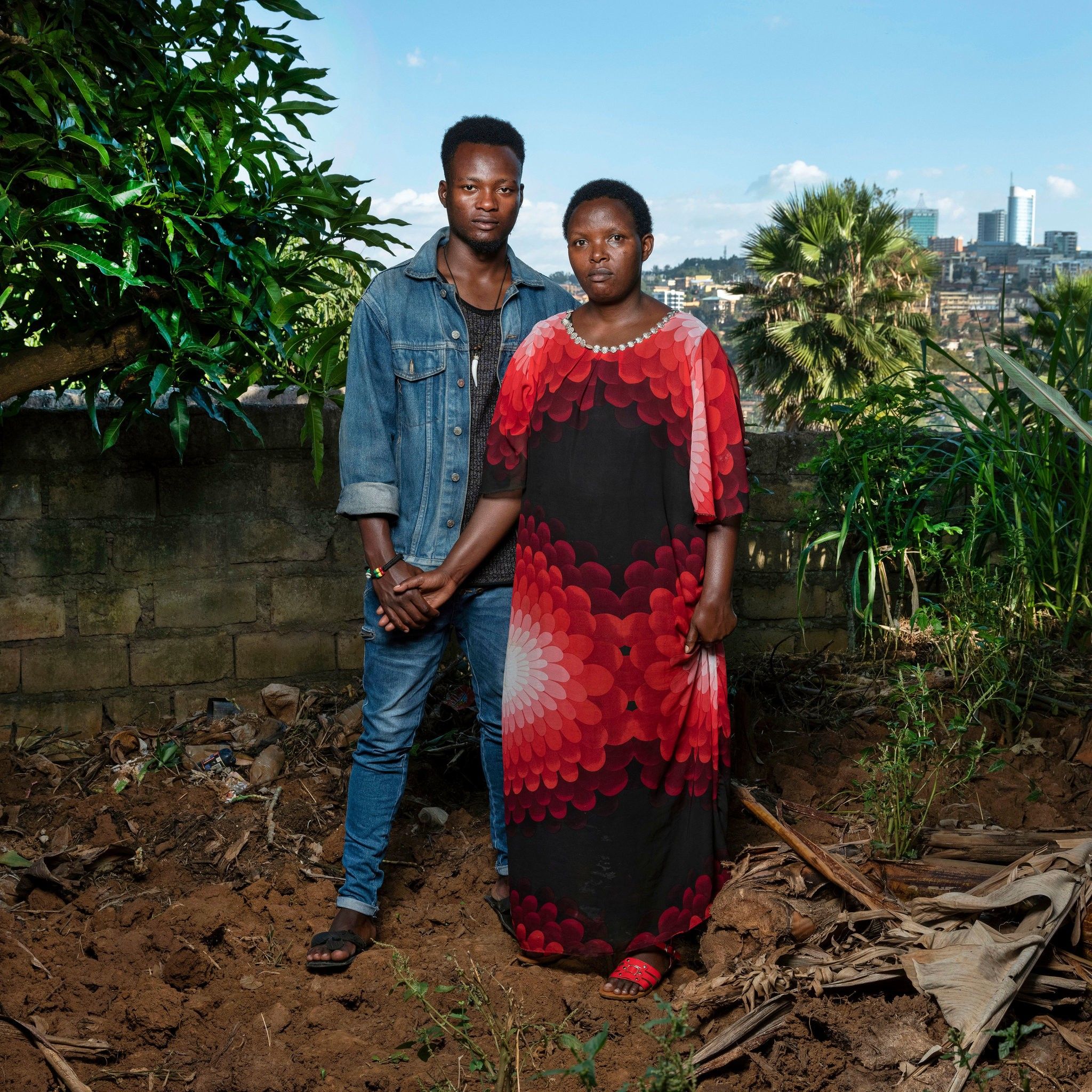 Josette, 40, and her son Thomas, 24: Josette was beaten and raped by militiamen. After the genocide, a pregnant Josette was rejected by members of her family. Thomas is now training to be a plumber. Image by Jonathan Torgovnik. Rwanda, 2018.