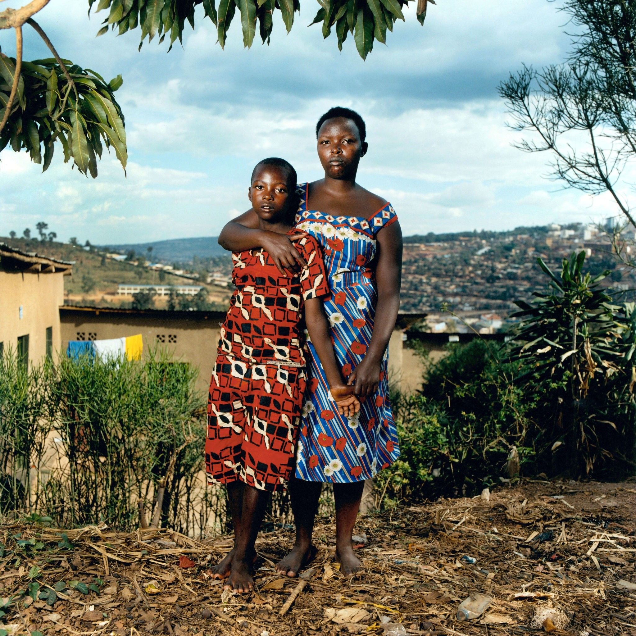 Josette, 40, and her son Thomas, 24: Josette was beaten and raped by militiamen. After the genocide, a pregnant Josette was rejected by members of her family. Thomas is now training to be a plumber. Image by Jonathan Torgovnik. Rwanda, 2006