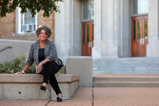 Judy Gladney, 67, poses for a portrait at University City High School on Monday, Sept. 30, 2019, ahead of her 50th high school reunion. Gladney was among the first waves of African American students to integrate the high school. Image by Cristina M. Fletes. United States, 2019.