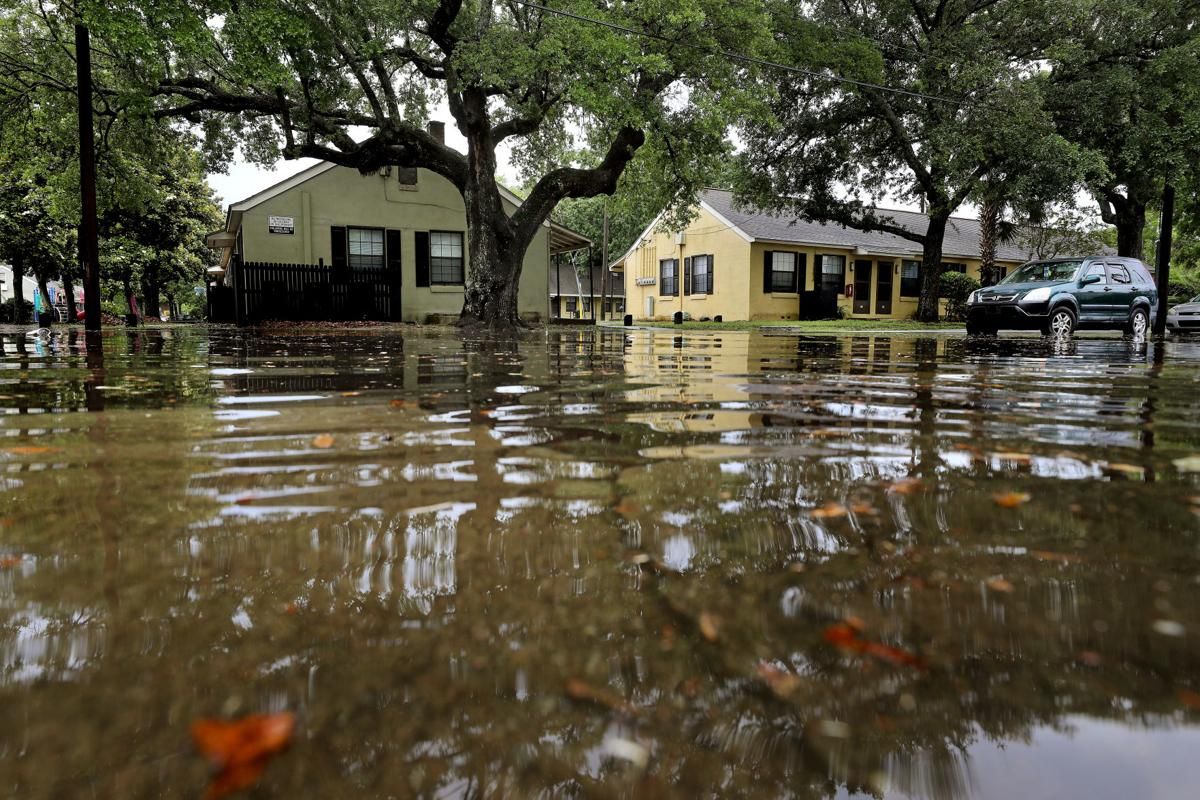 The streets and neighborhoods on America Street, on Charleston’s East Side, were covered by water after several inches of rain fell on Wednesday, May 20, 2020. Flooding and pooling water around public housing on the East Side are common occurrences, even when it’s not raining. Image by Grace Beahm Alford / The Post and Courier. United States, 2020.