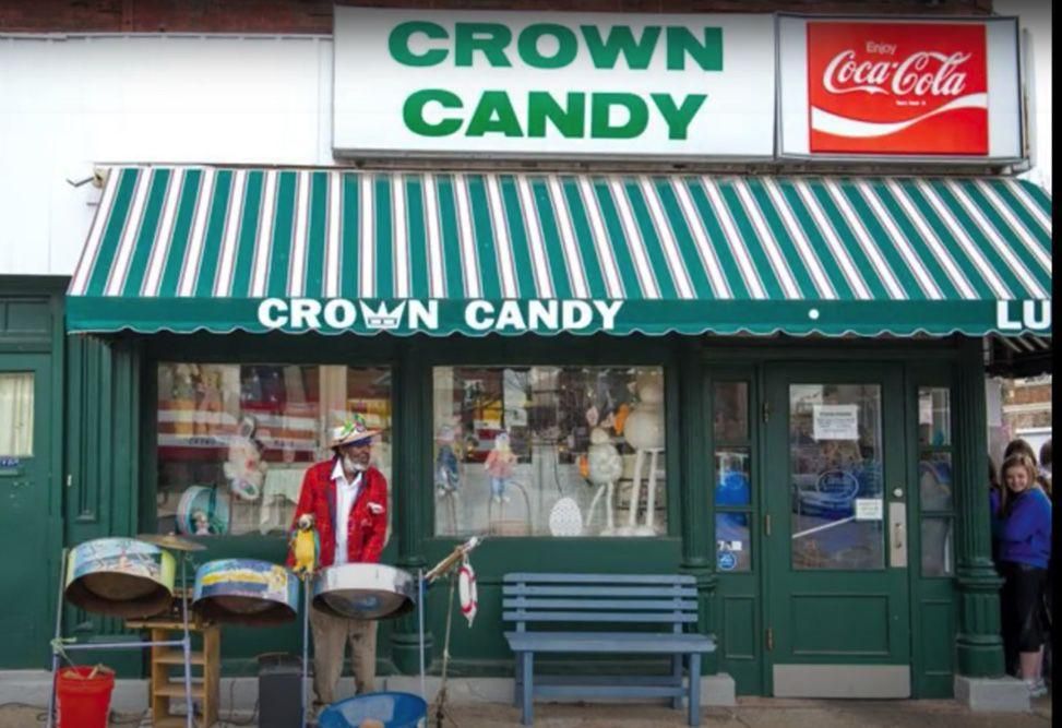 Jamaica Ray with drums outside Crown Candy. Image by Sylvester Brown / The St. Louis American. United States, 2020.