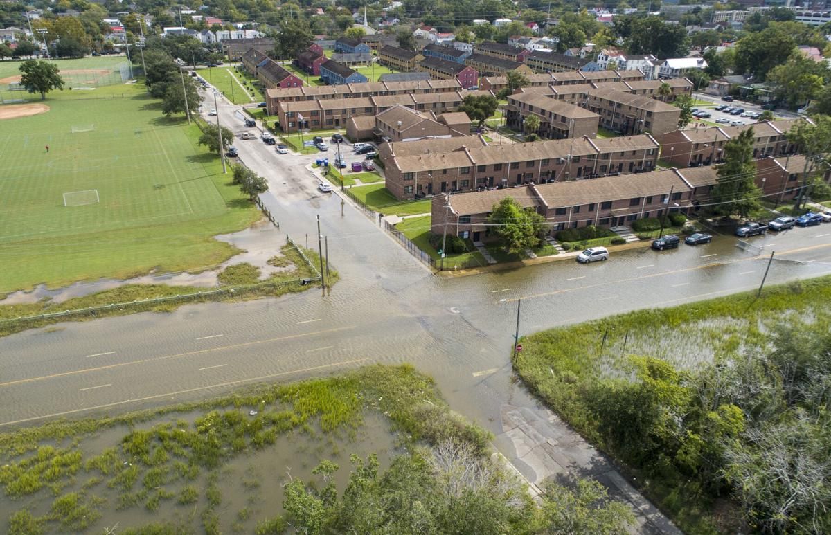 The intersection of Line Street and Hagood Avenue during a high tide just before noon on Sunday, Sept. 20, 2020, in Charleston. Residents in the nearby Gadsden Green public housing complex are impacted by the area’s regular flooding. Image by Andrew J. Whitaker / The Post and Courier. United States, 2020.

