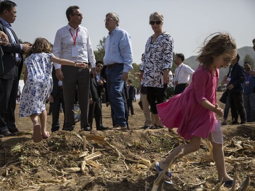Ambassador Terry Branstad's granddaughters Stella, in the foreground, and Sofia Costa play at the edge of a corn field during the groundbreaking ceremony for the China-US Demonstration Farm on Saturday, Sept. 23, 2017, in Luanping County, Hebei. Image by Kelsey Kremer. 