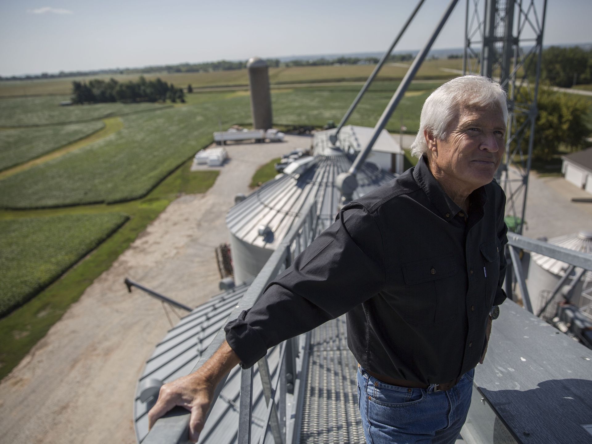 Rick Kimberley, a fifth generation family farmer of Maxwell, stands at the top of one of his grain bins on a late summer day, Tuesday, Sept. 5, 2017, in rural Polk County. Kimberley's farm is being used as a model for the China-US Demonstration Farm being built in China. Image by Kelsey Kremer.