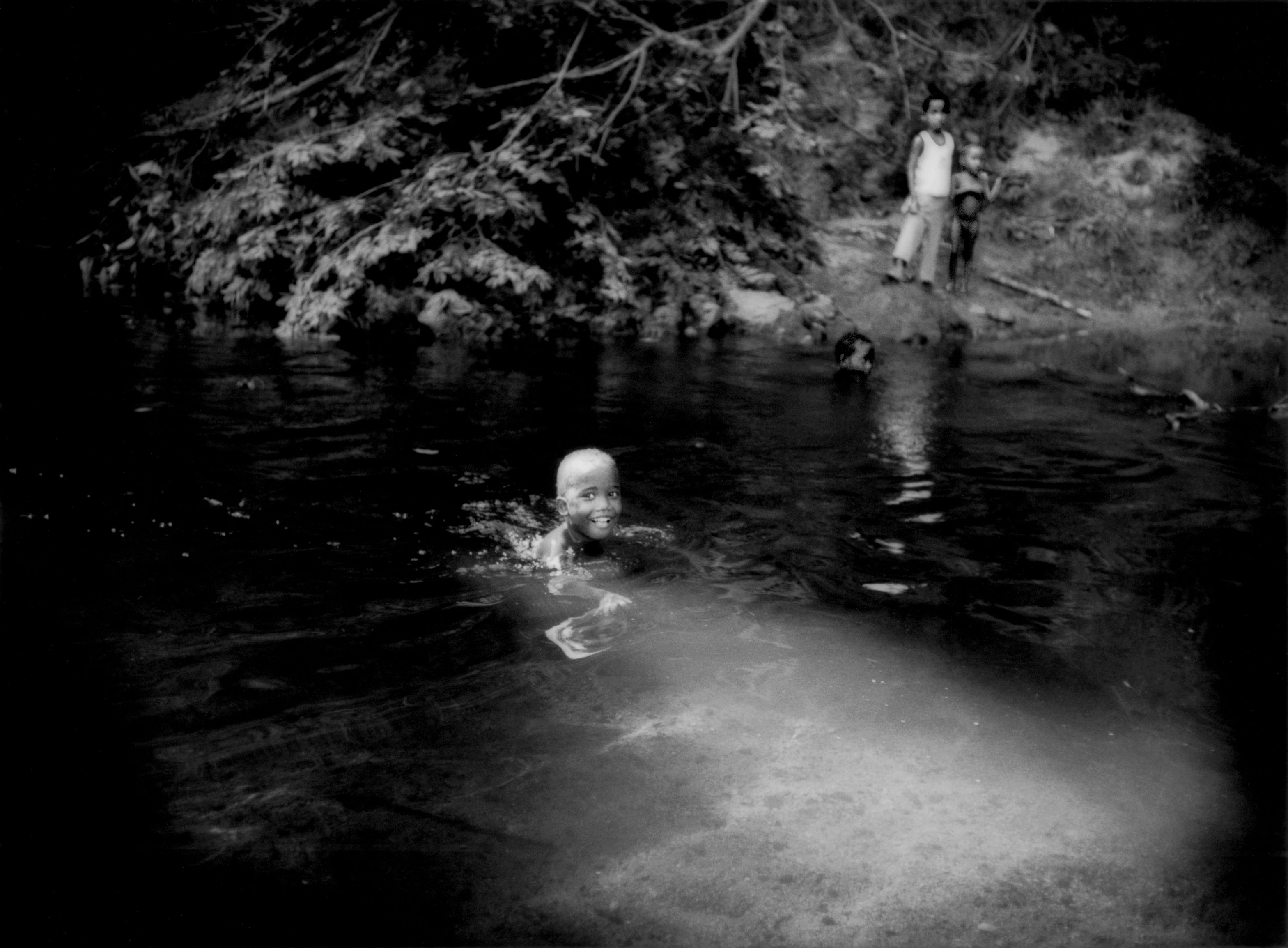 A little Batek boy swims in the river. Image by James Whitlow Delano. Malaysia, 2011.